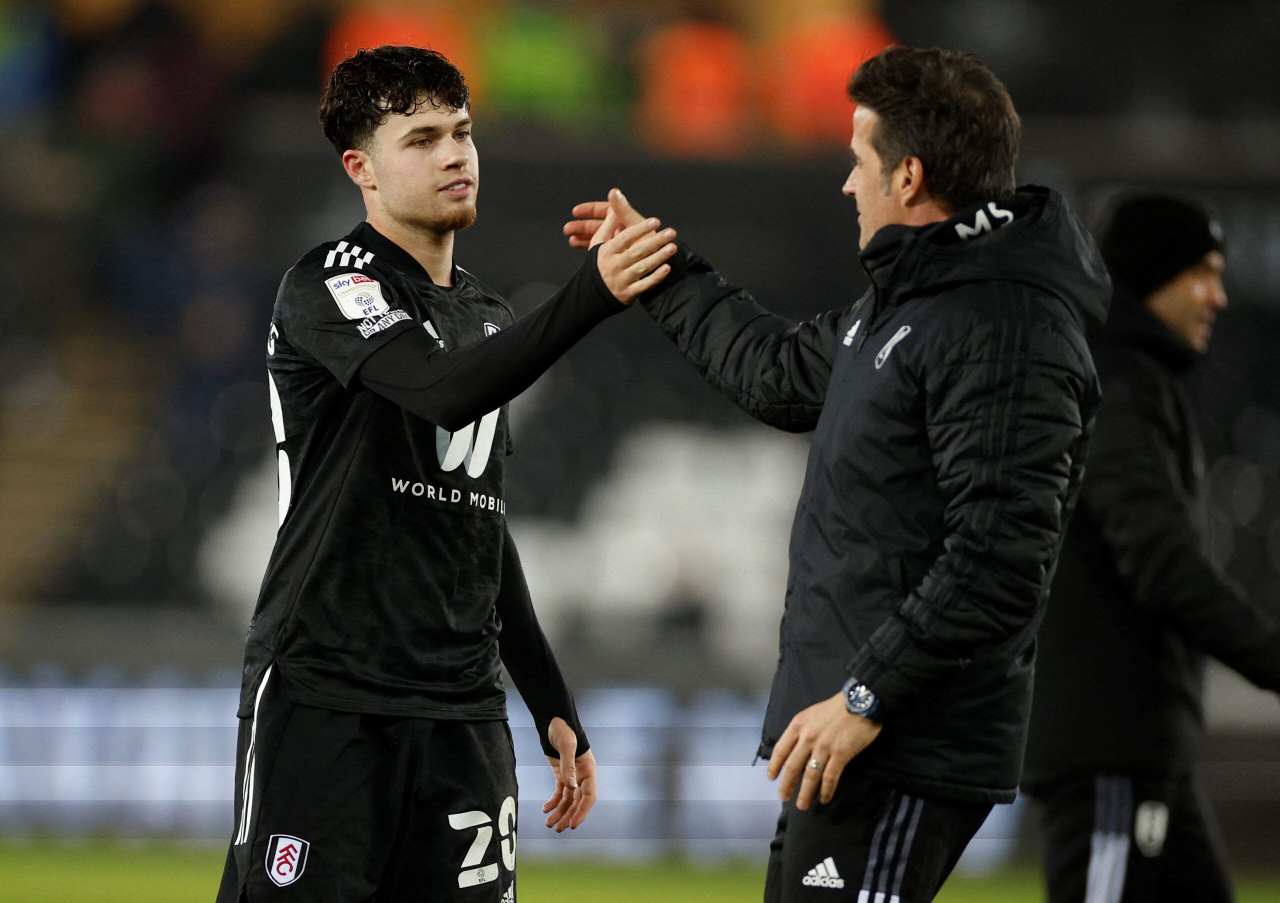 Soccer Football - Championship - Swansea City v Fulham - Swansea.com Stadium, Swansea, Britain - March 8, 2022  Fulham?s Neco Williams celebrates with manager Marco Silva after the match  Action Images/John Sibley  EDITORIAL USE ONLY. No use with unauthorized audio, video, data, fixture lists, club/league logos or 