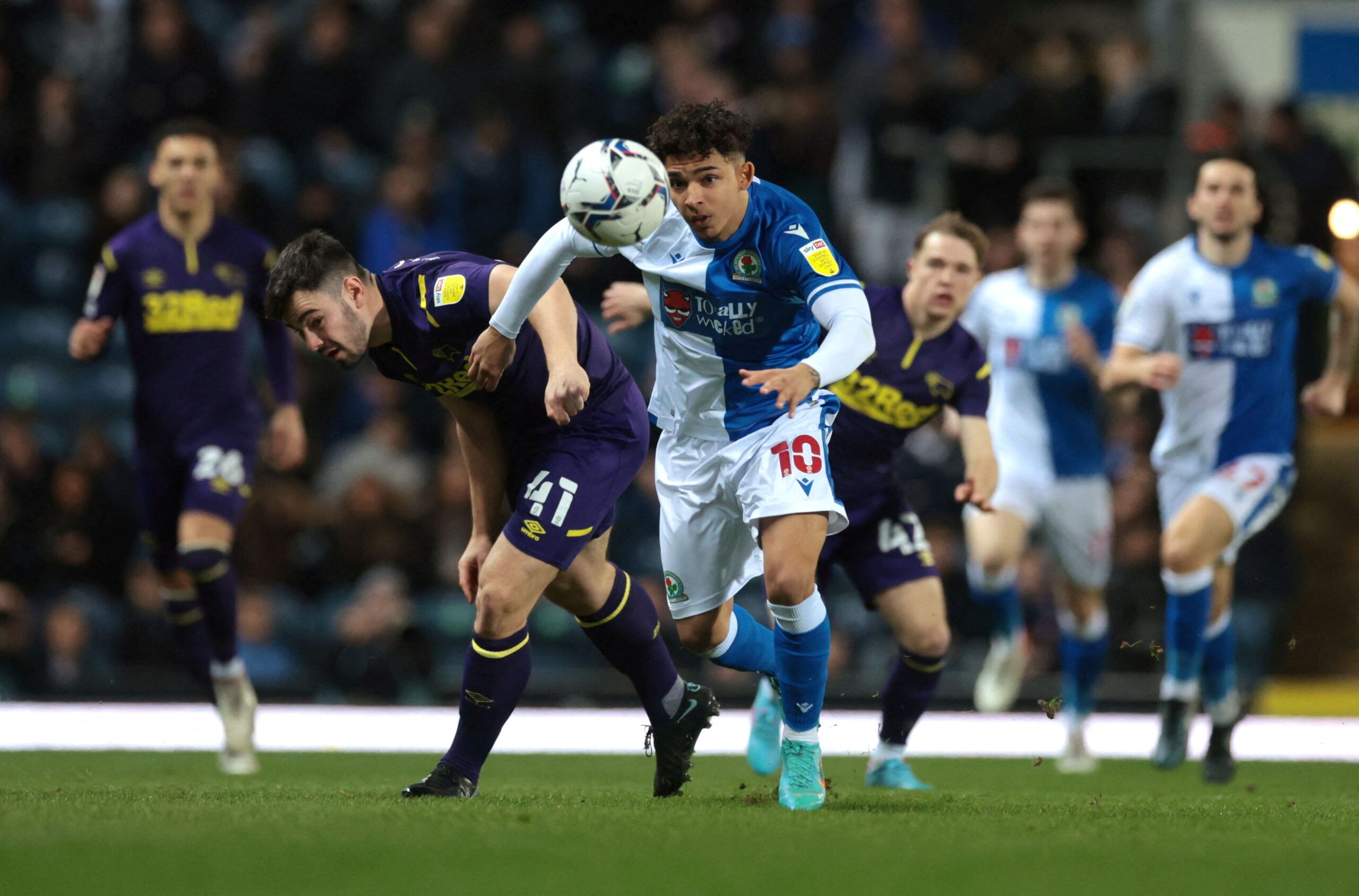 Soccer Football - Championship - Blackburn Rovers v Derby County - Ewood Park, Blackburn, Britain - March 15, 2022  Derby County?s Eiran Cashin in action with Blackburn Rovers' Tyrhys Dolan  Action Images/Lee Smith  EDITORIAL USE ONLY. No use with unauthorized audio, video, data, fixture lists, club/league logos or 
