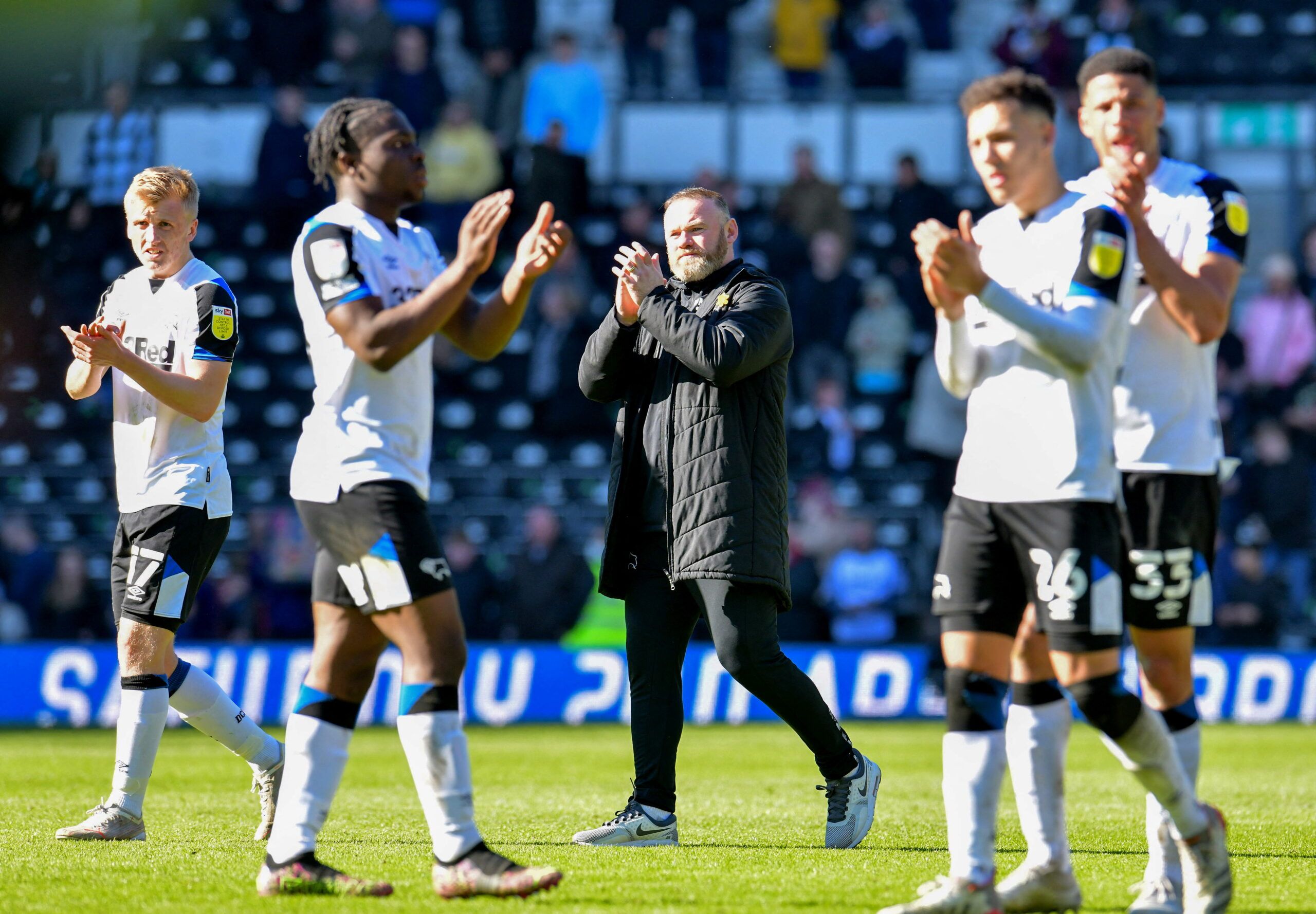 Soccer Football - Championship - Derby County v Coventry City - Pride Park, Derby, Britain - March 19, 2022 Derby County manager Wayne Rooney and his player applaud fans after the match Action Images/Paul Burrows  EDITORIAL USE ONLY. No use with unauthorized audio, video, data, fixture lists, club/league logos or 