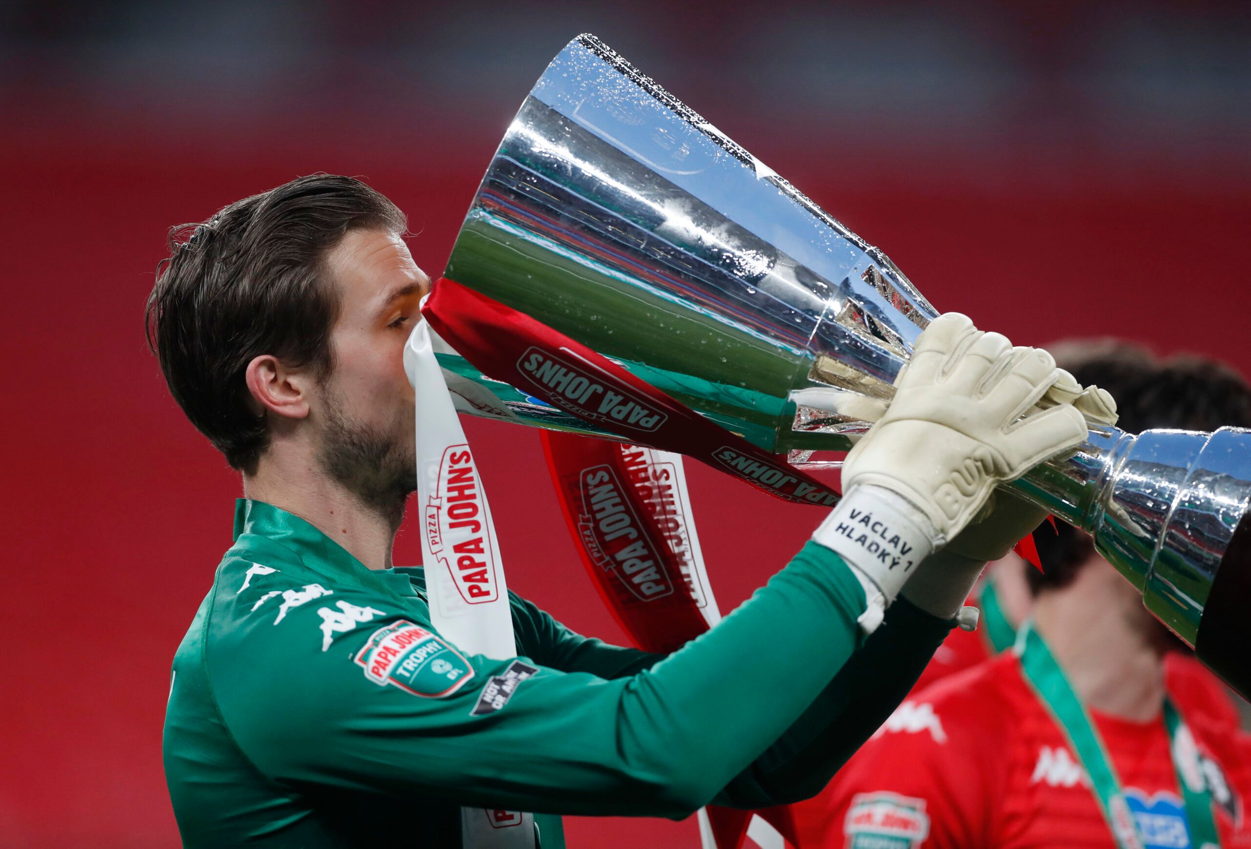 Soccer Football - 2019/20 EFL Trophy Final - Portsmouth v Salford City - Wembley Stadium, London, Britain - March 13, 2021 Salford's Vaclav Hladky celebrates with the trophy Action Images/Matthew Childs EDITORIAL USE ONLY. No use with unauthorized audio, video, data, fixture lists, club/league logos or 'live' services. Online in-match use limited to 75 images, no video emulation. No use in betting, games or single club /league/player publications.  Please contact your account representative for 