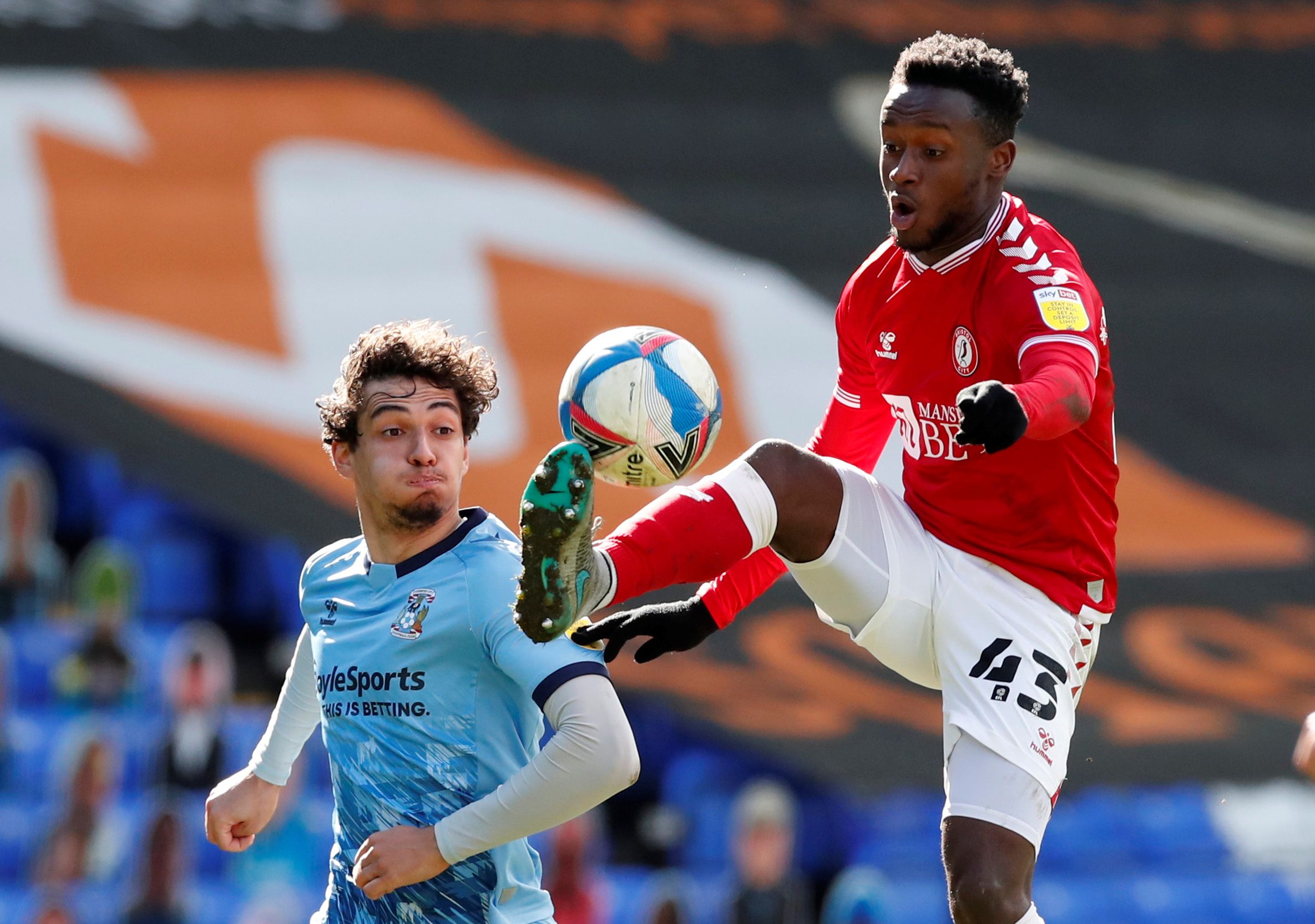 Soccer Football - Championship - Coventry City v Bristol City - St Andrew's, Birmingham, Britain - April 5, 2021  Bristol City's Steven Sessegnon in action with Coventry City's Tyler Walker  Action Images/Andrew Boyers  EDITORIAL USE ONLY. No use with unauthorized audio, video, data, fixture lists, club/league logos or "live" services. Online in-match use limited to 75 images, no video emulation. No use in betting, games or single club/league/player publications.  Please contact your account rep