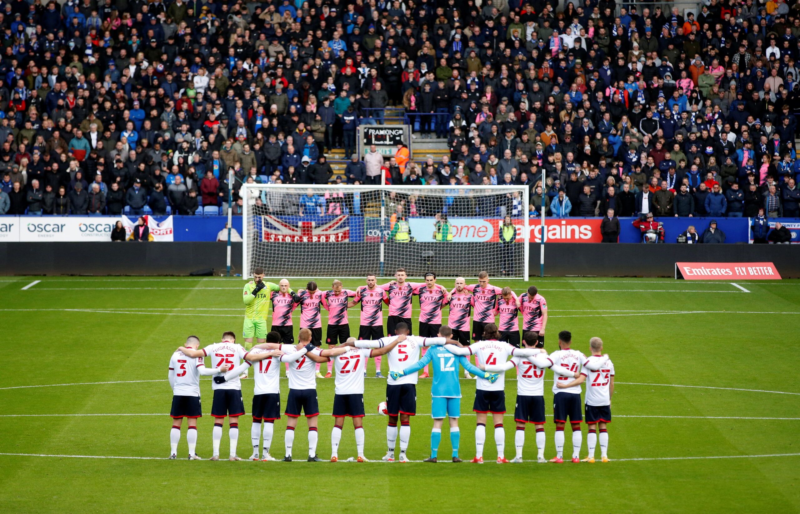 Soccer Football - FA Cup - First Round - Bolton Wanderers v Stockport County - University of Bolton Stadium, Bolton, Britain - November 7, 2021 Players during a minutes silence as part of remembrance commemorations before the match