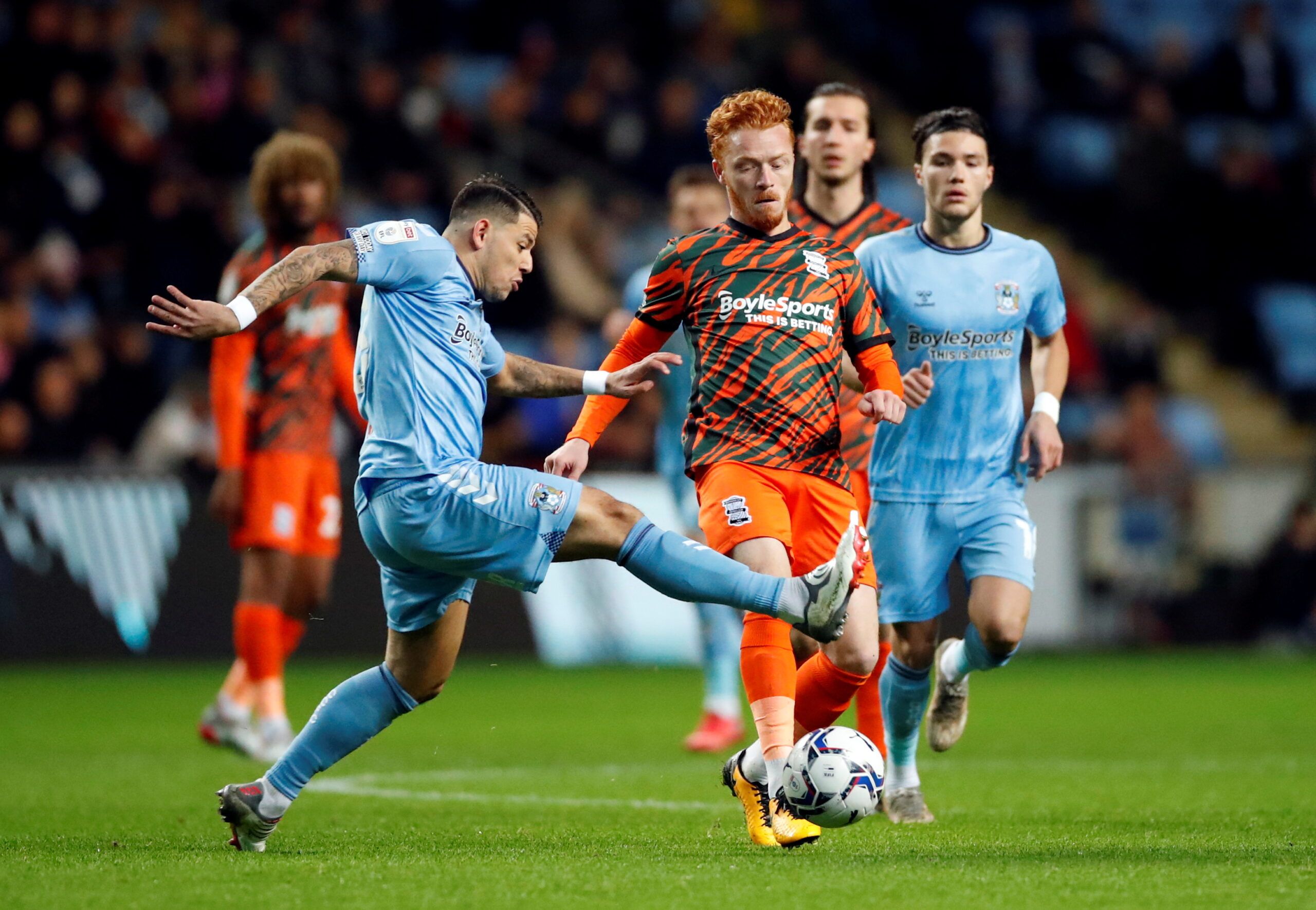 Soccer Football - Championship - Coventry City v Birmingham City - Building Society Arena, Coventry, Britain - November 23, 2021 Coventry City's Gustavo Hamer in action with Birmingham City's Marc Roberts   Action Images/Andrew Boyers