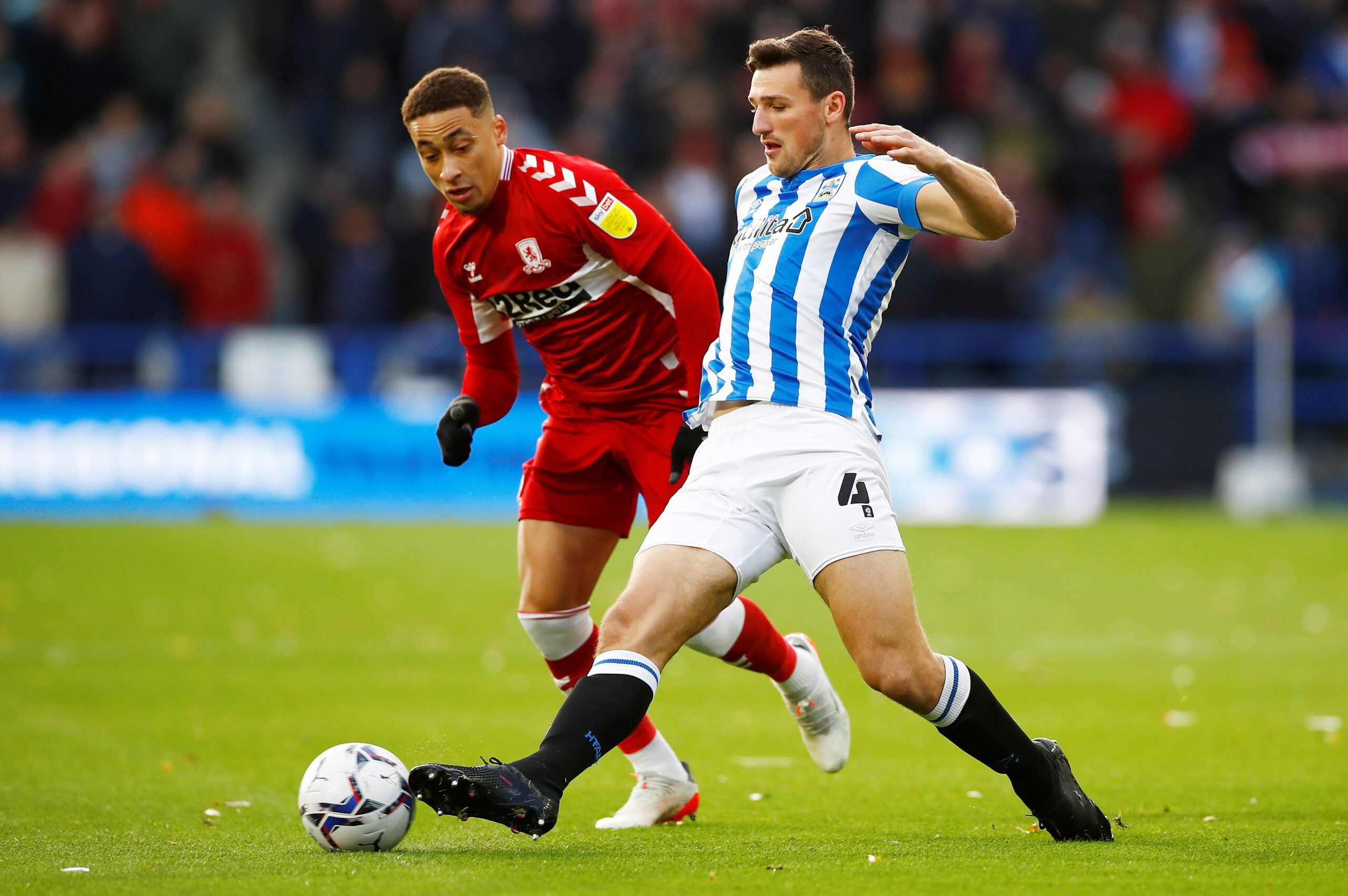 Soccer Football - Championship - Huddersfield Town v Middlesbrough - John Smith's Stadium, Huddersfield, Britain - November 27, 2021 Middlesbrough's Marcus Tavernier in action with Huddersfield Town's Matty Pearson Action Images/Jason Cairnduff
