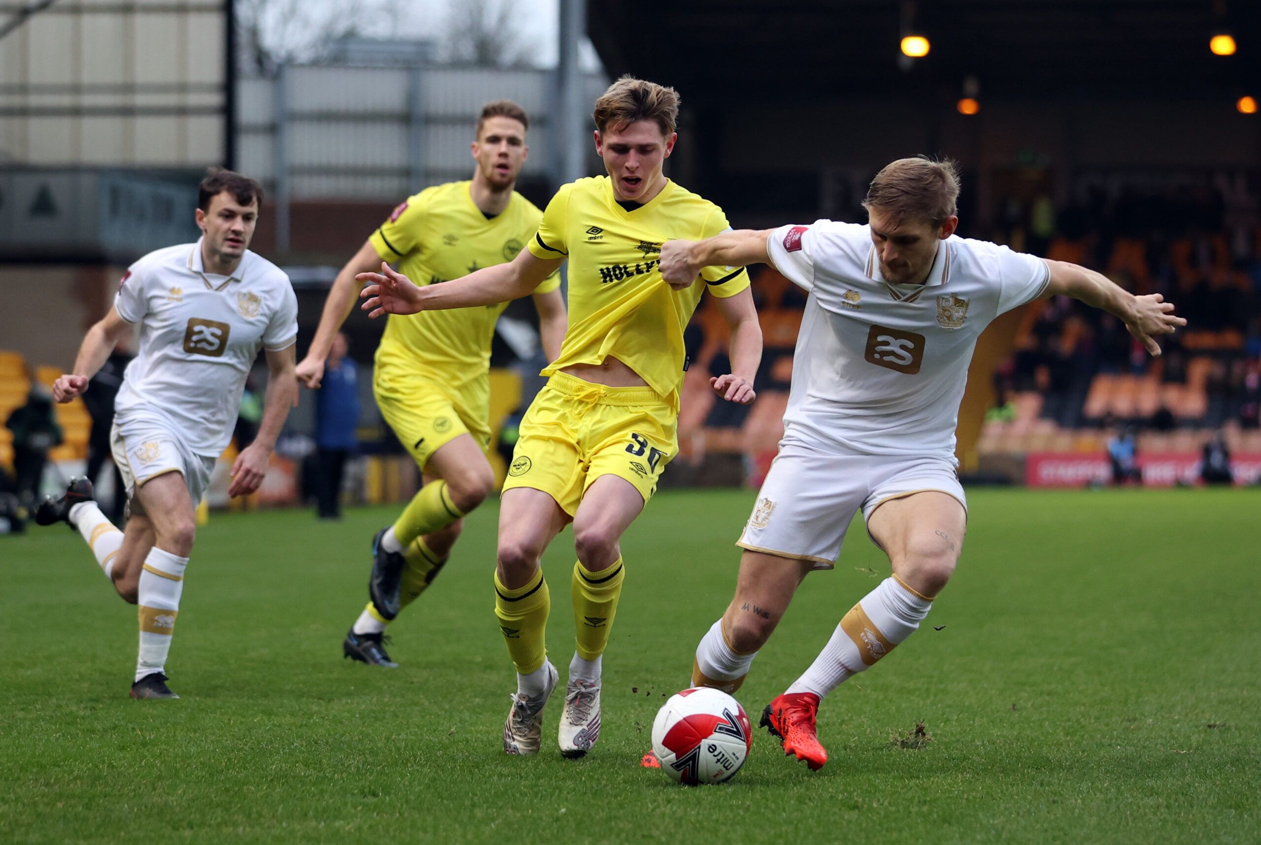 Soccer Football - FA Cup Third Round - Port Vale v Brentford - Vale Park, Stoke-on-Trent, Britain - January 8, 2022  Port Vale's Nathan Smith in action with Brentford's Finley Stevens Action Images via Reuters/Molly Darlington