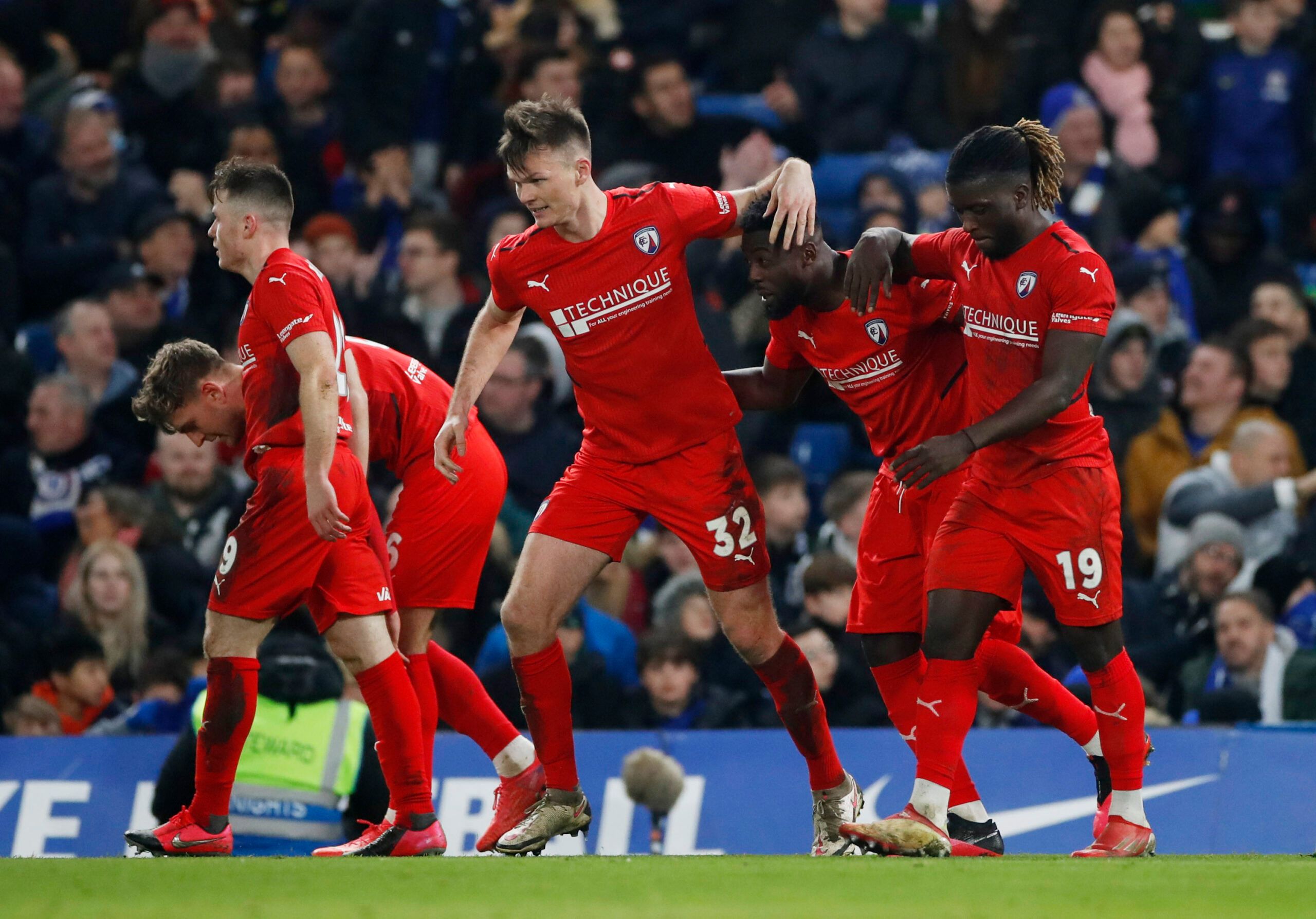 Soccer Football - FA Cup Third Round - Chelsea v Chesterfield - Stamford Bridge, London, Britain - January 8, 2022  Chesterfield's Akwasi Asante celebrates scoring their first goal with Kabongo Tshimanga and Fraser Kerr Action Images via Reuters/Paul Childs