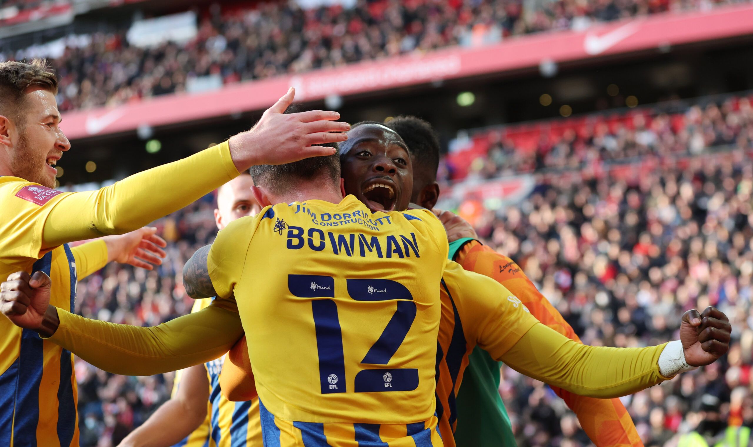 Soccer Football - FA Cup Third Round - Liverpool v Shrewsbury Town - Anfield, Liverpool, Britain - January 9, 2022 Shrewsbury Town's Daniel Udoh celebrates scoring their first goal with Ryan Bowman REUTERS/Phil Noble