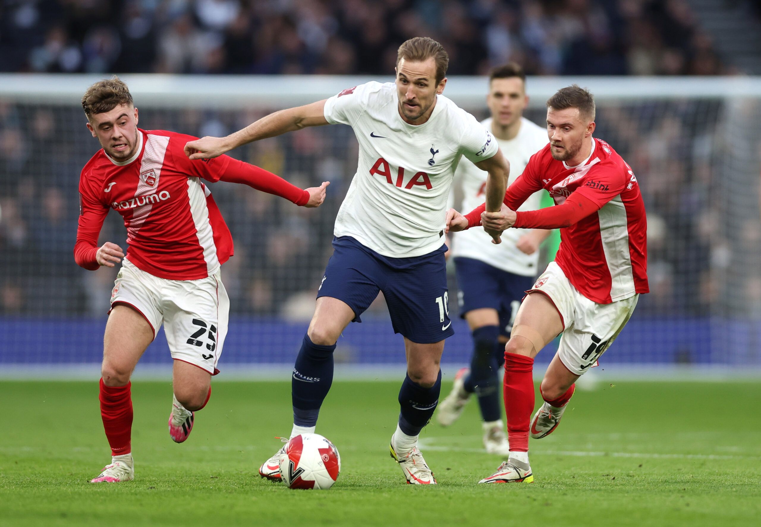 Soccer Football - FA Cup Third Round - Tottenham Hotspur v Morecambe - Tottenham Hotspur Stadium, London, Britain - January 9, 2022 Tottenham Hotspur's Harry Kane in action with Morecambe's Alfie McCalmont Action Images via Reuters/Matthew Childs