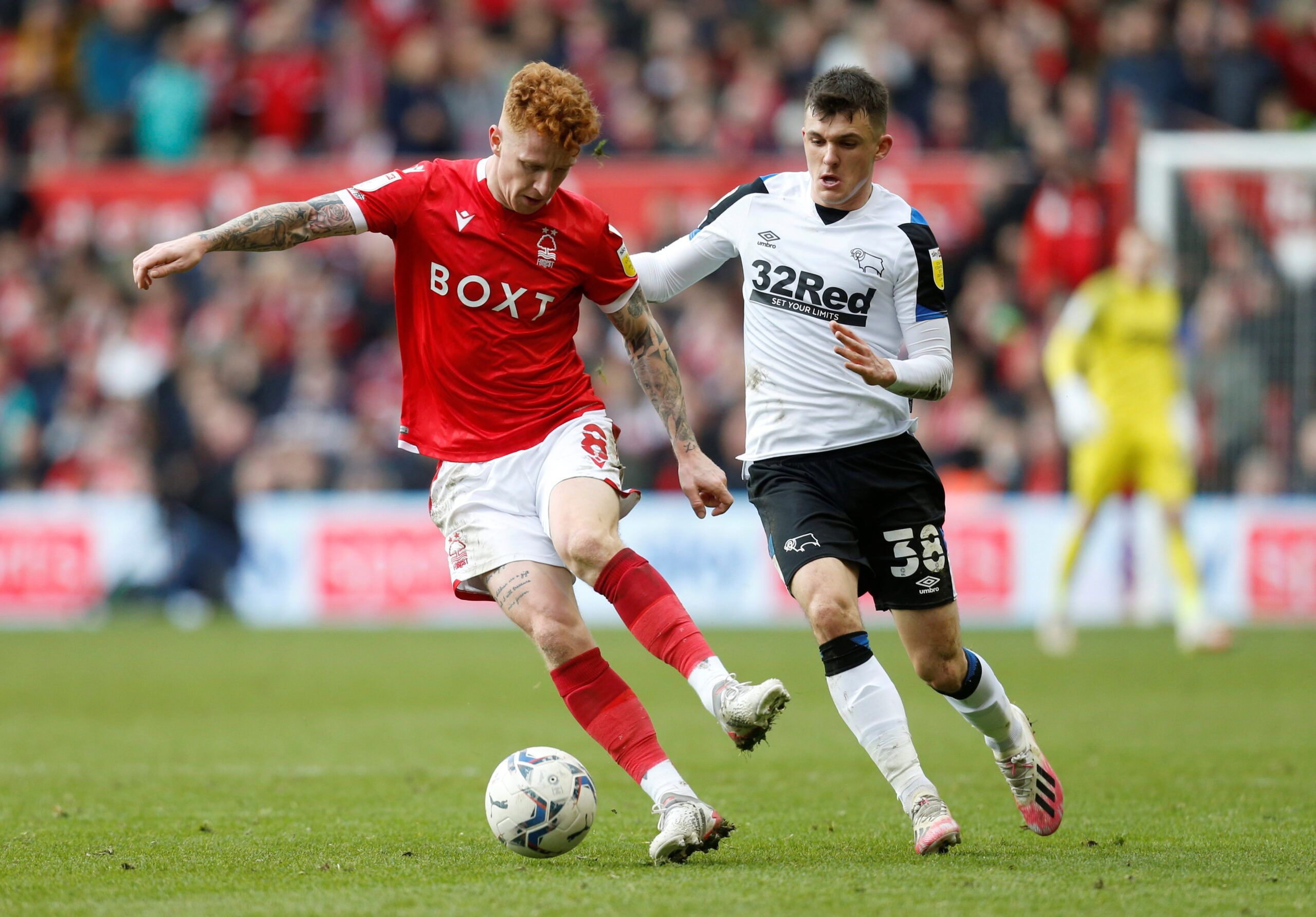 Soccer Football - Championship - Nottingham Forest v Derby County - The City Ground, Nottingham, Britain - January 22, 2022 Nottingham Forest's Jack Colback in action with Derby County's Jason Knight   Action Images/Ed Sykes  EDITORIAL USE ONLY. No use with unauthorized audio, video, data, fixture lists, club/league logos or 