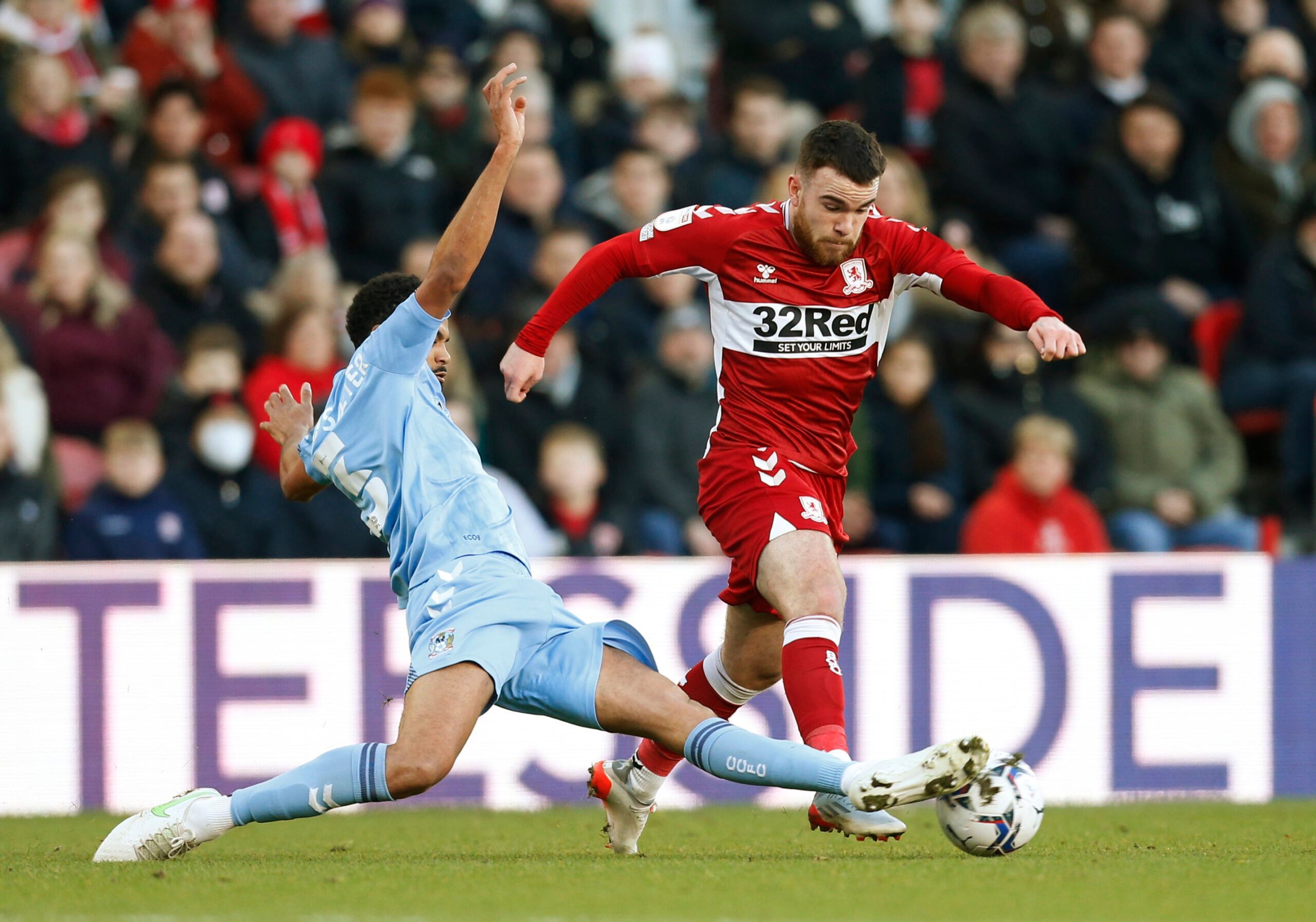 Soccer Football - Championship - Middlesbrough v Coventry City - Riverside Stadium, Middlesbrough, Britain - January 29, 2022 Middlesbrough's Aaron Connolly in action with Coventry City's Jake Clark-Salter Action Images/Ed Sykes EDITORIAL USE ONLY. No use with unauthorized audio, video, data, fixture lists, club/league logos or 'live' services. Online in-match use limited to 75 images, no video emulation. No use in betting, games or single club /league/player publications.  Please contact your a