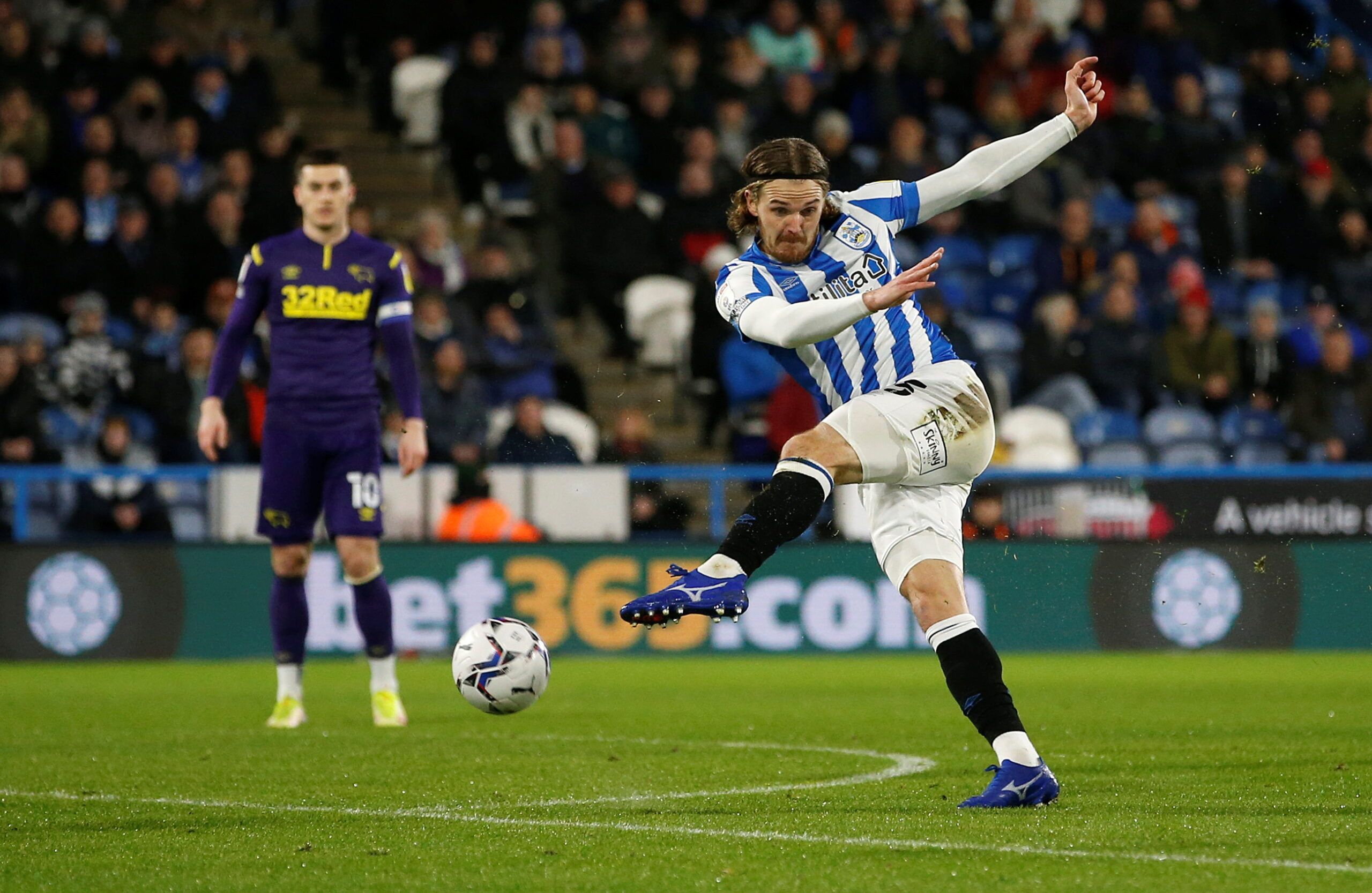 Soccer Football - Championship - Huddersfield Town v Derby County - John Smith's Stadium, Huddersfield, Britain - February 2, 2022 Huddersfield Town's Danny Ward shoots at goal  Action Images/Ed Sykes EDITORIAL USE ONLY. No use with unauthorized audio, video, data, fixture lists, club/league logos or 'live' services. Online in-match use limited to 75 images, no video emulation. No use in betting, games or single club /league/player publications. Please contact your account representative for fur