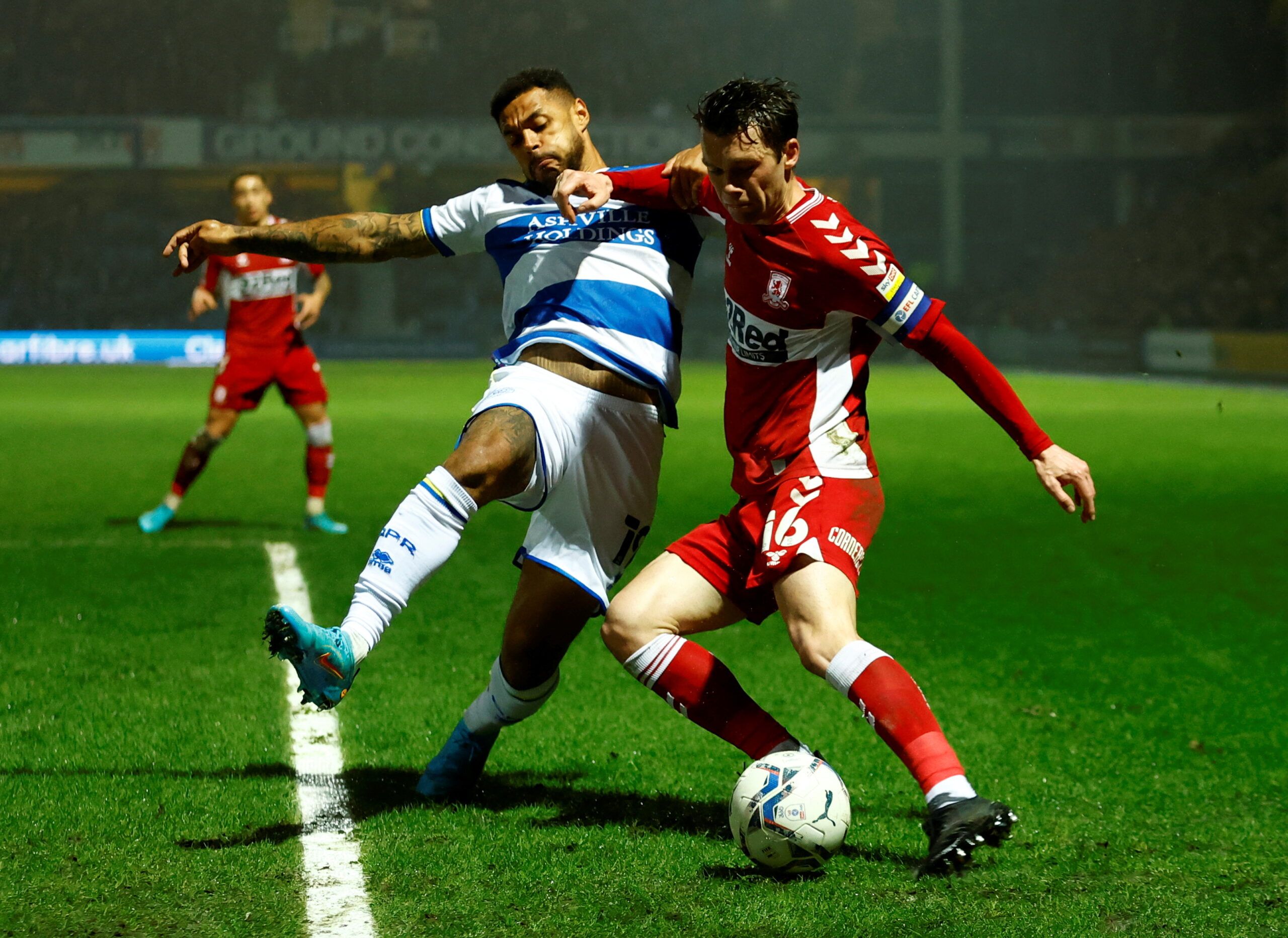Soccer Football - Championship - Queens Park Rangers v Middlesbrough - Loftus Road, London, Britain - February 9, 2022  Queens Park Rangers' Andre Gray in action with Middlesbrough's Jonny Howson  Action Images/Andrew Boyers  EDITORIAL USE ONLY. No use with unauthorized audio, video, data, fixture lists, club/league logos or 