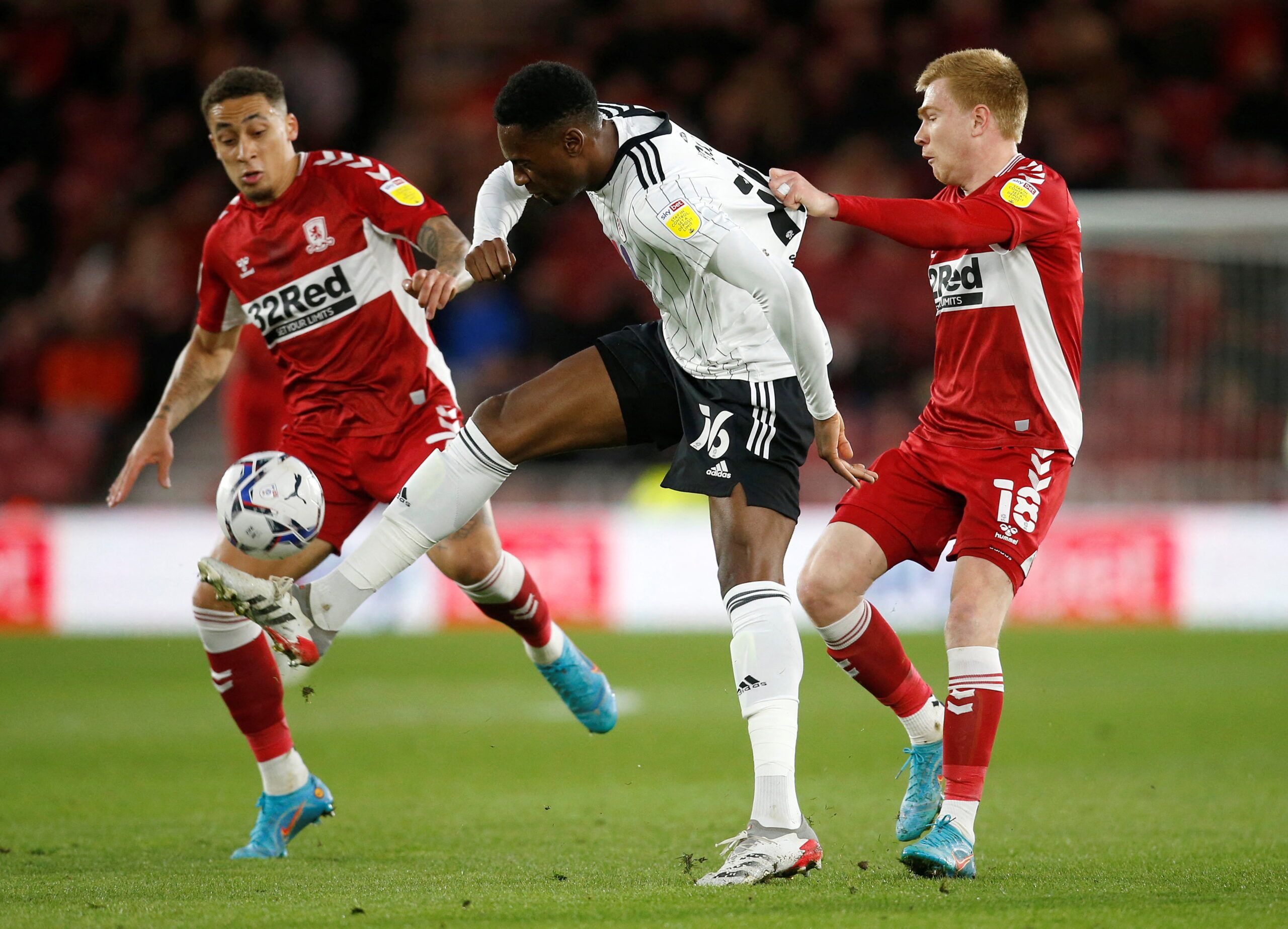 Soccer Football - Championship - Middlesbrough v Fulham - Riverside Stadium, Middlesbrough, Britain - April 6, 2022 Fulham's Tosin Adarabioyo in action with Middlesbrough's Marcus Tavernier and Duncan Watmore  Action Images/ Ed Sykes  EDITORIAL USE ONLY. No use with unauthorized audio, video, data, fixture lists, club/league logos or 