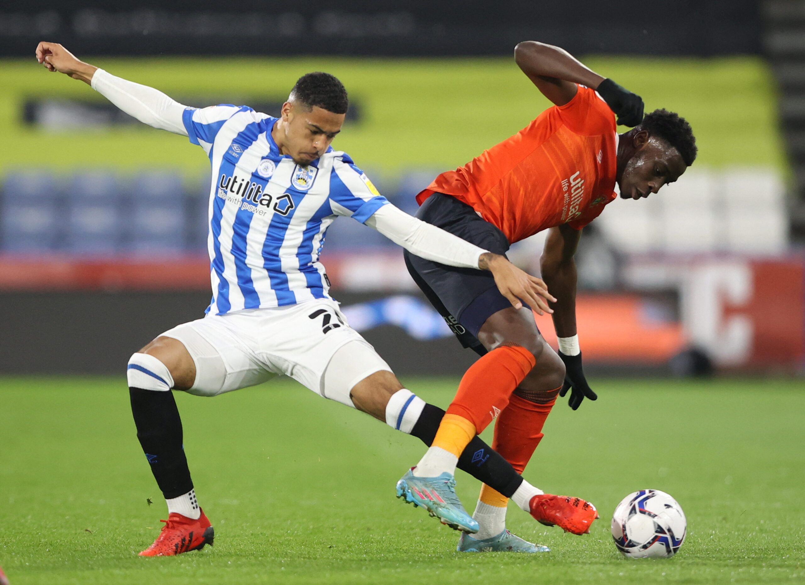 Soccer Football - Championship - Huddersfield Town v Luton Town - John Smith's Stadium, Huddersfield, Britain - April 11, 2022  Huddersfield Town's Levi Colwill in action with Luton Town's Elijah Adebayo  Action Images/Molly Darlington  EDITORIAL USE ONLY. No use with unauthorized audio, video, data, fixture lists, club/league logos or 