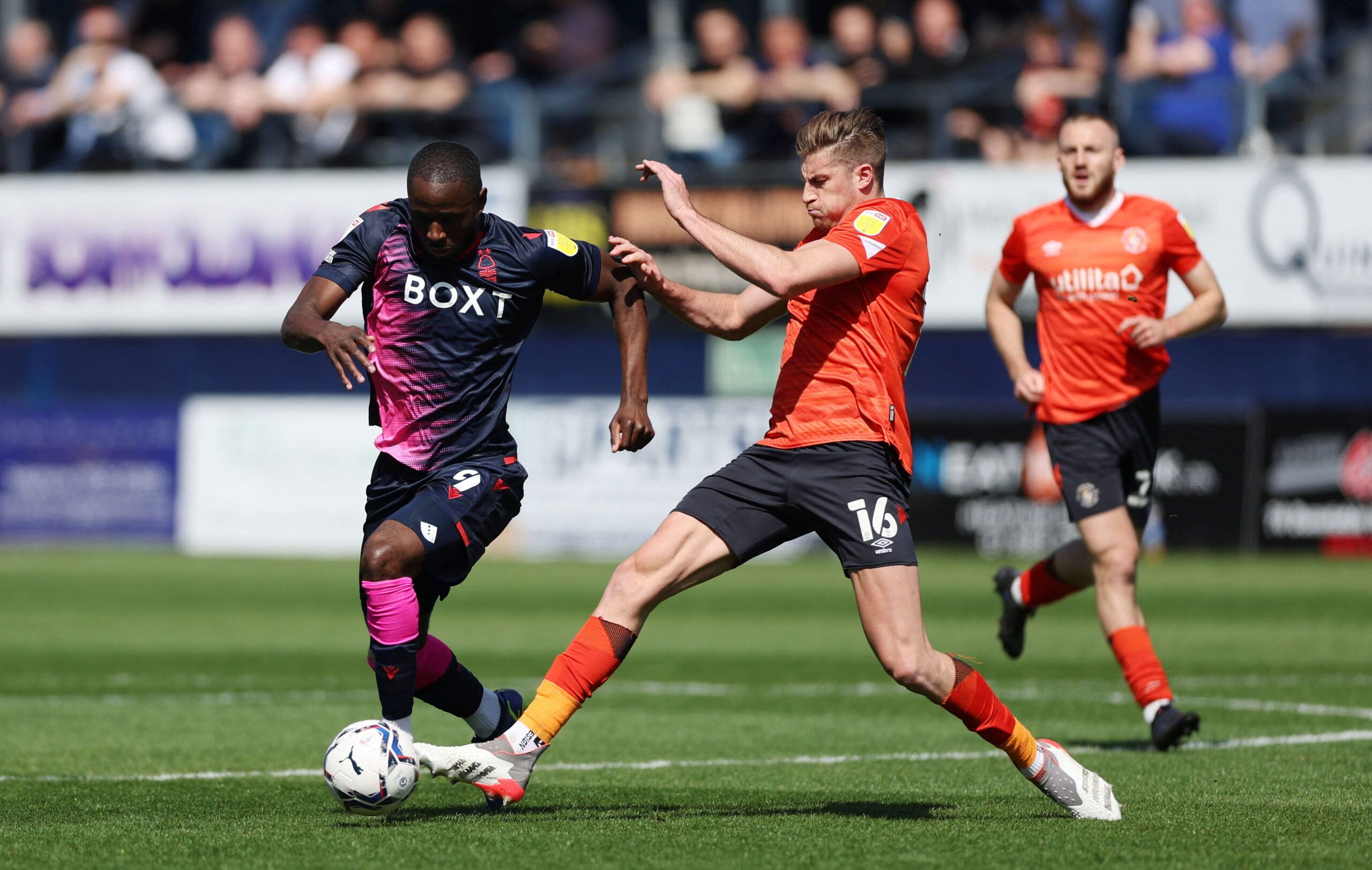 Soccer Football - Championship - Luton Town v Nottingham Forest - Kenilworth Road, Luton, Britain - April 15, 2022 Luton Town's Reece Burke in action with Nottingham Forest's Keinan Davis  Action Images/Matthew Childs  EDITORIAL USE ONLY. No use with unauthorized audio, video, data, fixture lists, club/league logos or 