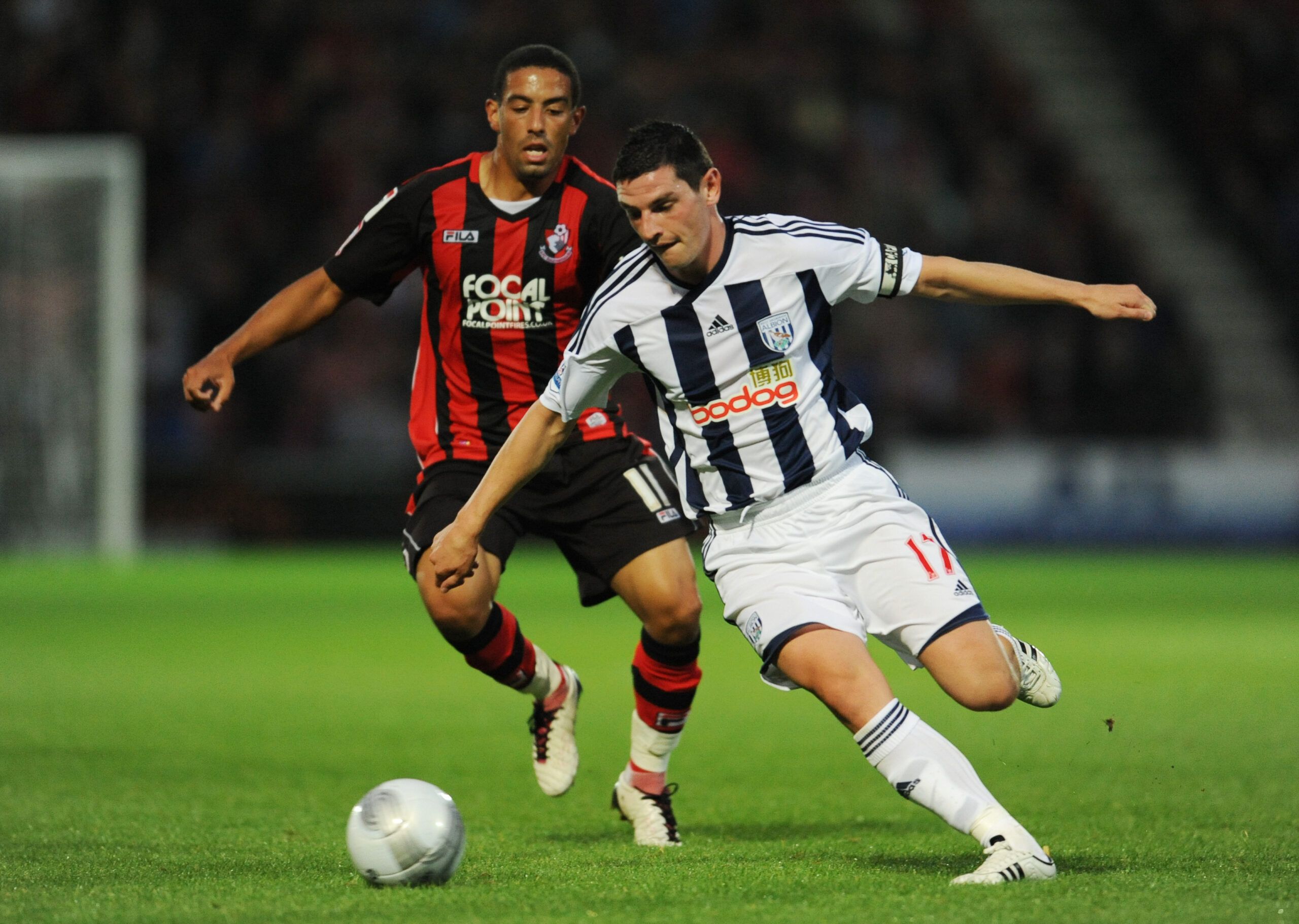 Football - AFC Bournemouth v West Bromwich Albion - Carling Cup Second Round - Dean Court - 11/12 - 23/8/11 
Liam Feeney (L) - AFC Bournemouth in action against Graham Dorrans - West Bromwich Albion 
Mandatory Credit: Action Images / Tony O'Brien 
EDITORIAL USE ONLY. No use with unauthorized audio, video, data, fixture lists, club/league logos or live services. Online in-match use limited to 45 images, no video emulation. No use in betting, games or single club/league/player publications.