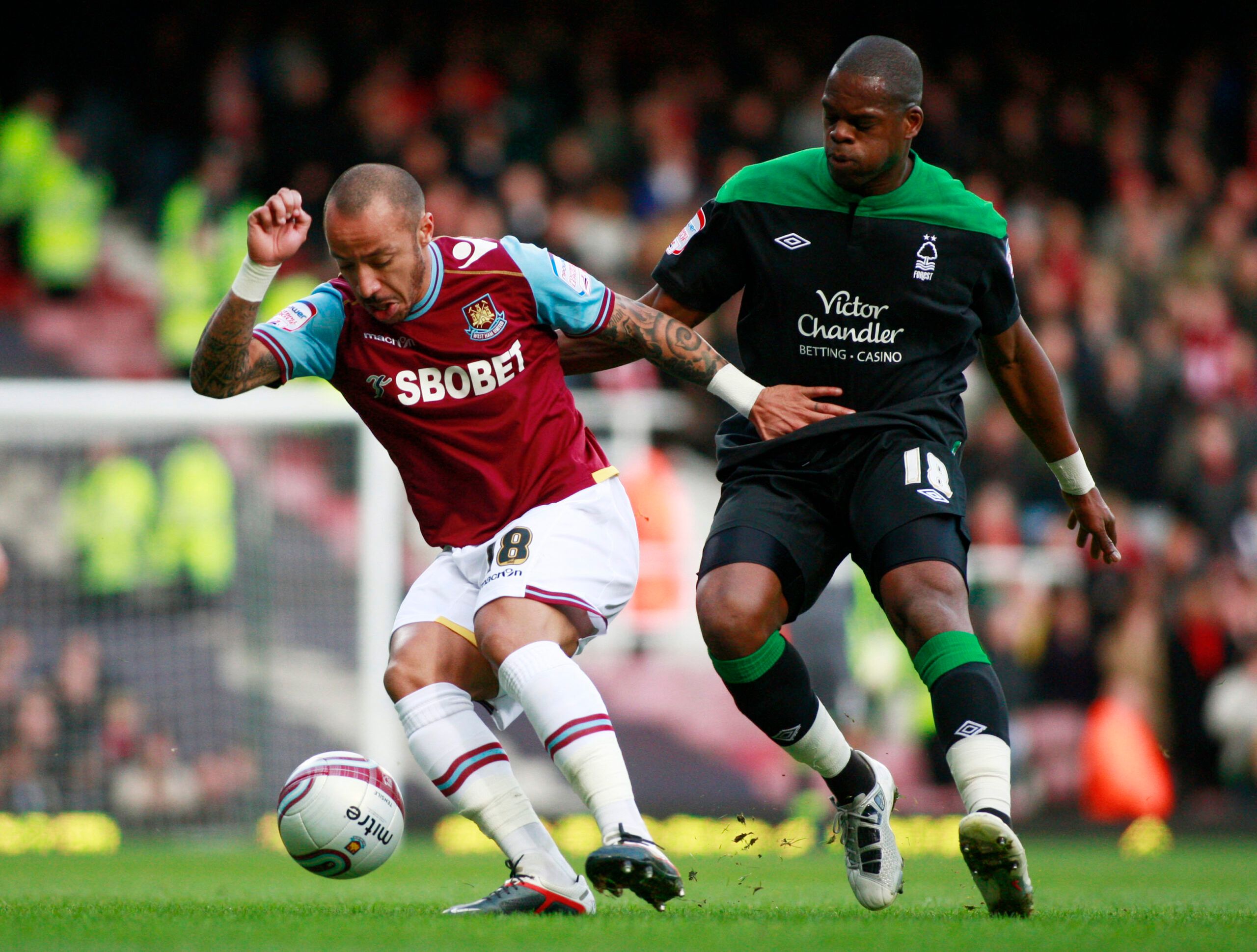 Football - West Ham United v Nottingham Forest npower Football League Championship - Upton Park - 21/1/12 
West Ham United's Julien Faubert with Marlon Harewood - Nottingham Forest n 
Mandatory Credit: Action Images / Lee Mills 
Livepic 
EDITORIAL USE ONLY. No use with unauthorized audio, video, data, fixture lists, club/league logos or live services. Online in-match use limited to 45 images, no video emulation. No use in betting, games or single club/league/player publications.  Please contact 