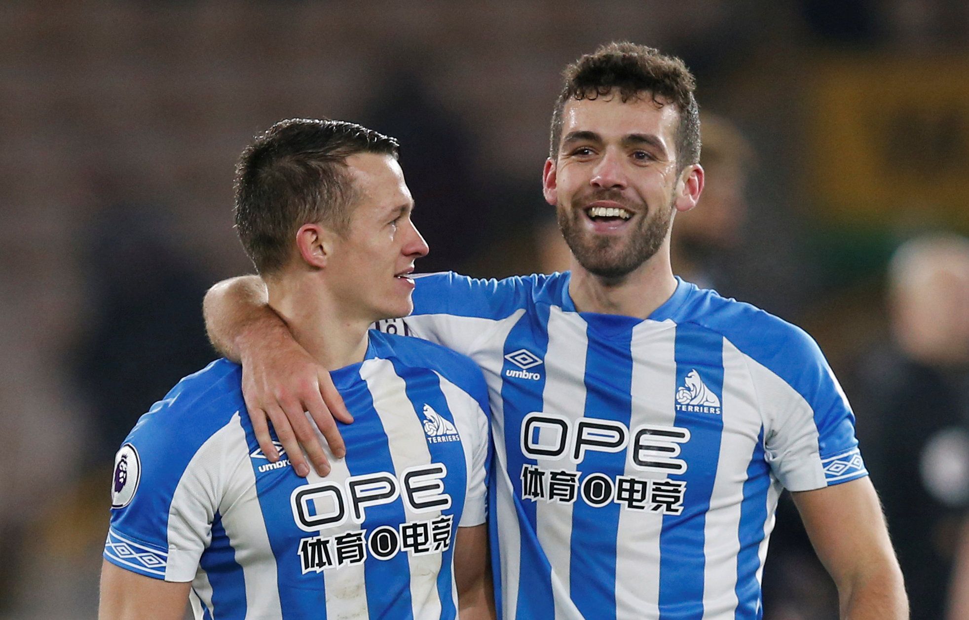 Soccer Football - Premier League - Wolverhampton Wanderers v Huddersfield Town - Molineux Stadium, Wolverhampton, Britain - November 25, 2018  Huddersfield Town's Tommy Smith and Jonathan Hogg celebrate victory after the match   REUTERS/Andrew Yates  EDITORIAL USE ONLY. No use with unauthorized audio, video, data, fixture lists, club/league logos or 