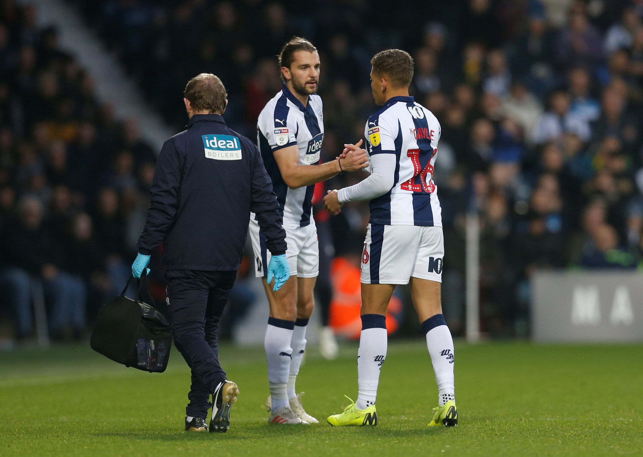 Soccer Football - Championship - West Bromwich Albion v Wigan Athletic - The Hawthorns, West Bromwich, Britain - December 26, 2018  West Bromwich Albion's Dwight Gayle with Jay Rodriguez as he leaves the pitch after sustaining an injury  Action Images/Ed Sykes  EDITORIAL USE ONLY. No use with unauthorized audio, video, data, fixture lists, club/league logos or 