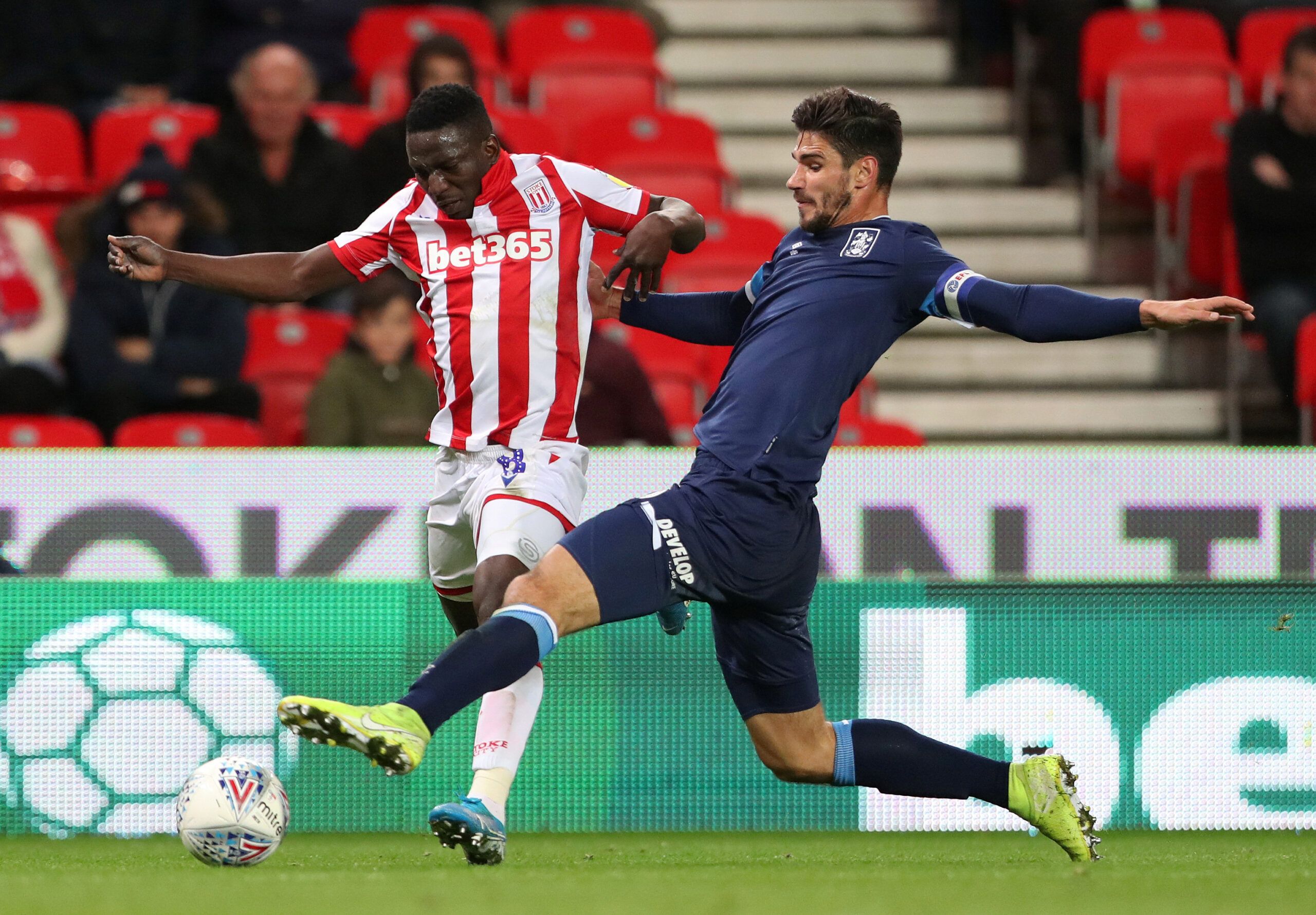 Soccer Football - Championship - Stoke City v Huddersfield Town - bet365 Stadium, Stoke-on-Trent, Britain - October 1, 2019   Huddersfield Town's Jonathan Hogg in action with Stoke City's Peter Etebo   Action Images/Molly Darlington    EDITORIAL USE ONLY. No use with unauthorized audio, video, data, fixture lists, club/league logos or 