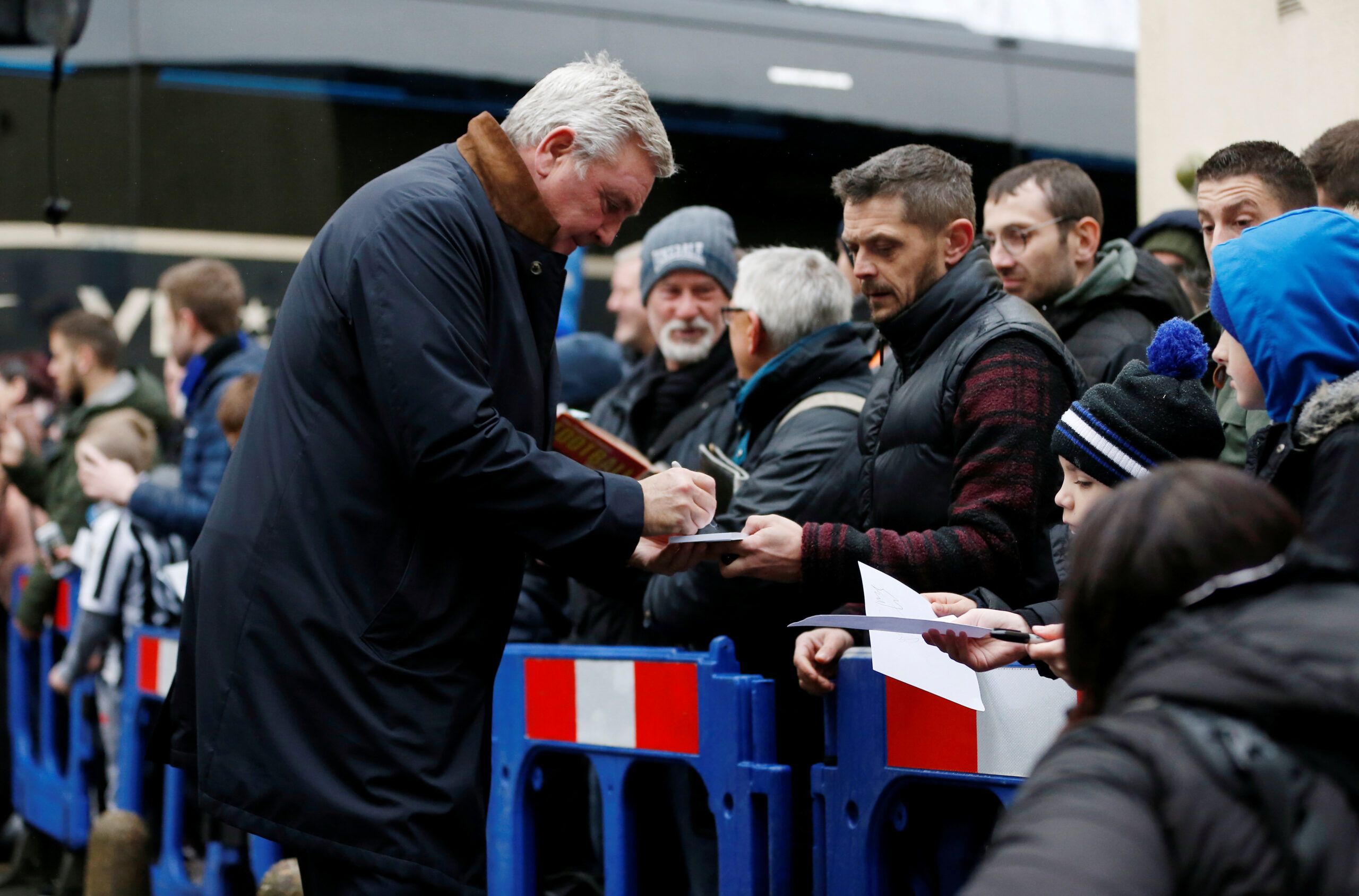 Soccer Football - FA Cup - Third Round - Rochdale v Newcastle United - The Crown Oil Arena, Rochdale, Britain - January 4, 2020 Newcastle United manager Steve Bruce aigns autographs for fans before the match   Action Images via Reuters/Craig Brough