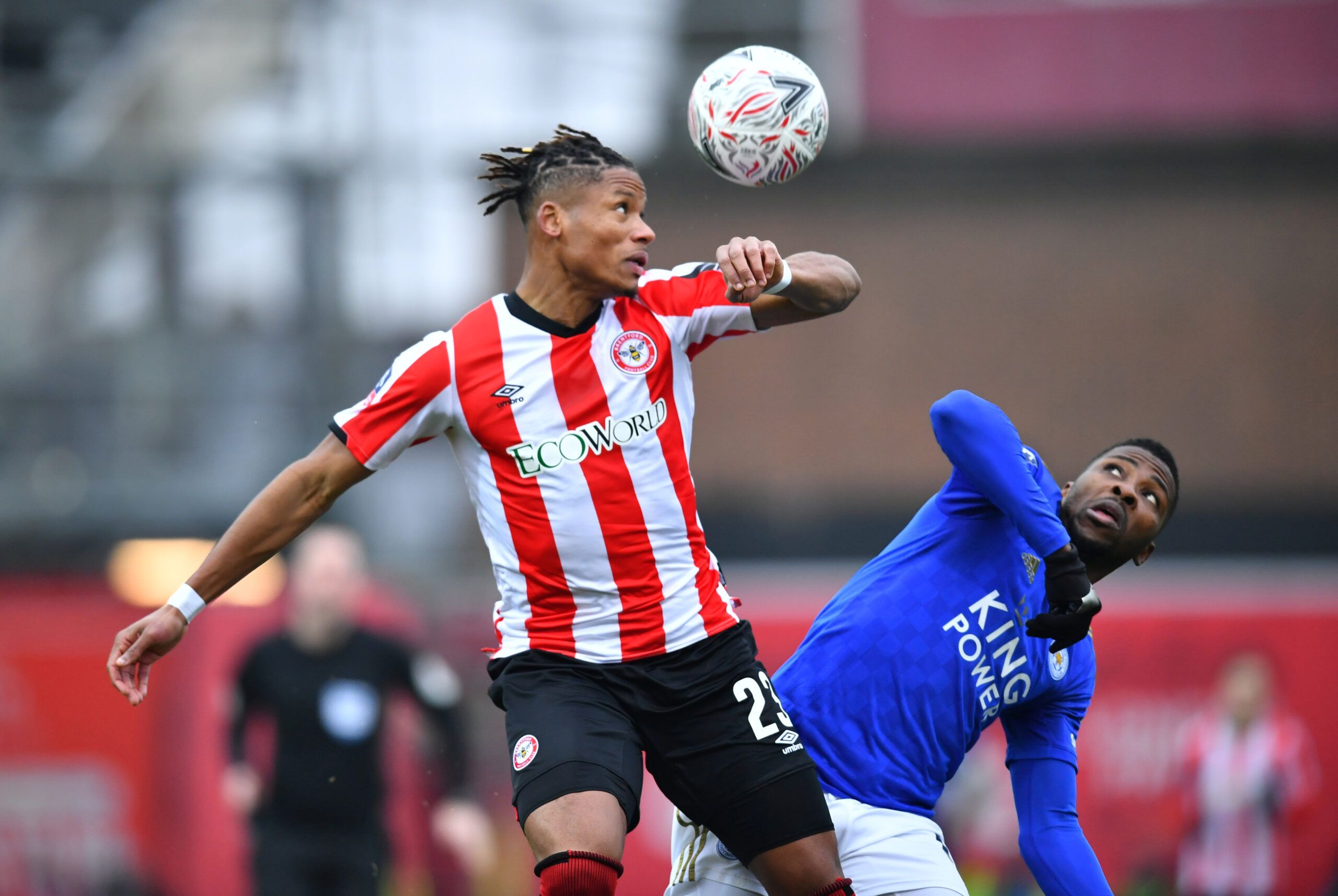 Soccer Football - FA Cup Fourth Round - Brentford v Leicester City - Griffin Park, Brentford, Britain - January 25, 2020  Brentford's Julian Jeanvier in action with Leicester City's Kelechi Iheanacho   REUTERS/Dylan Martinez