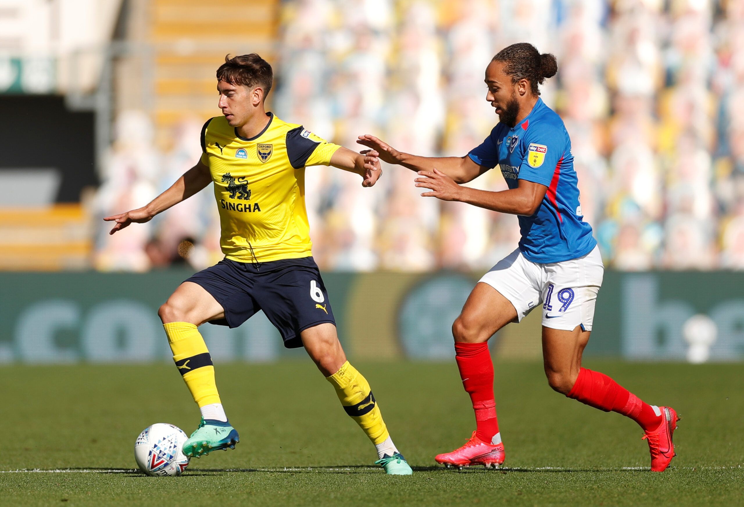 Soccer Football - League One Play Off Semi Final Second Leg - Oxford United v Portsmouth - Kassam Stadium, Oxford, Britain - July 6, 2020  Oxford's Alex Rodriguez in action with Portsmouth's Marcus Myers-Harness, as play resumes behind closed doors following the outbreak of the coronavirus disease (COVID-19)  Action Images/Matthew Childs  EDITORIAL USE ONLY. No use with unauthorized audio, video, data, fixture lists, club/league logos or 