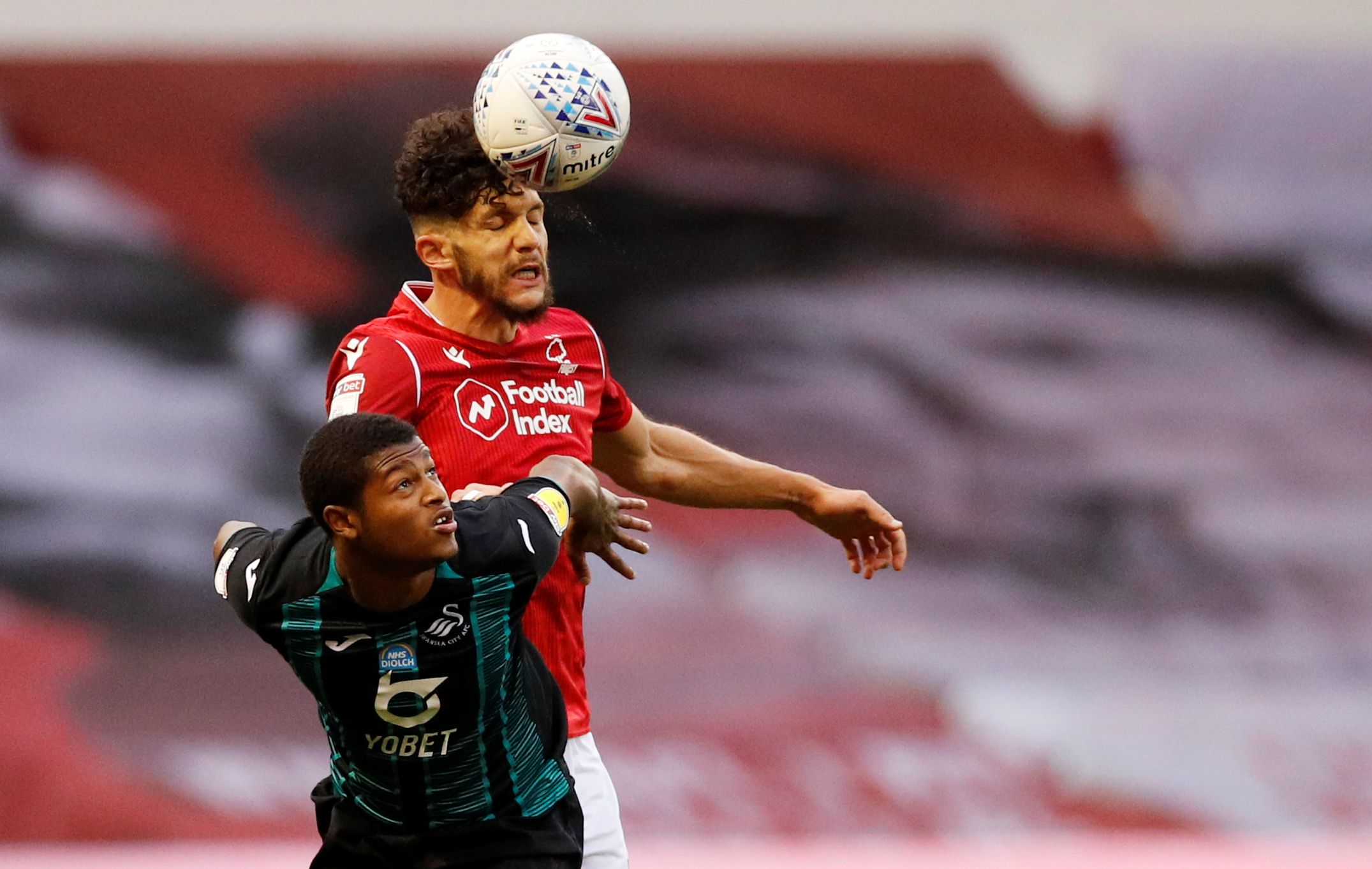 Soccer Football - Championship - Nottingham Forest v Swansea City - The City Ground, Nottingham, Britain - July 15, 2020   Nottingham Forest's Tobias Figueiredo in action with Swansea City's Rhian Brewster, as play resumes behind closed doors following the outbreak of the coronavirus disease (COVID-19)   Action Images/Andrew Boyers    EDITORIAL USE ONLY. No use with unauthorized audio, video, data, fixture lists, club/league logos or 