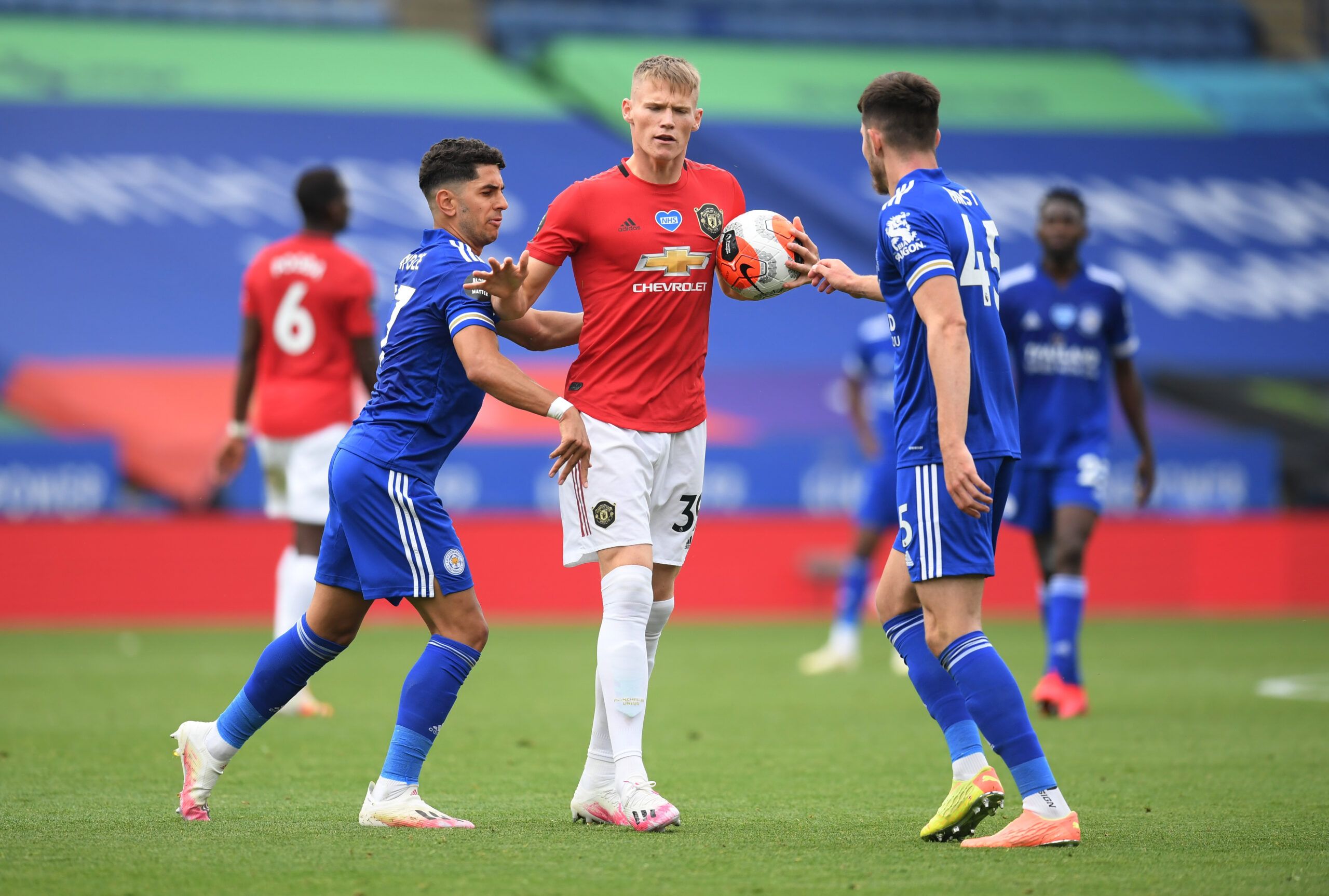 Soccer Football - Premier League - Leicester City v Manchester United - King Power Stadium, Leicester, Britain - July 26, 2020  Manchester United's Scott McTominay with Leicester City's Ayoze Perez and George Hirst, as play resumes behind closed doors following the outbreak of the coronavirus disease (COVID-19) Pool via REUTERS/Michael Regan EDITORIAL USE ONLY. No use with unauthorized audio, video, data, fixture lists, club/league logos or 'live' services. Online in-match use limited to 75 imag
