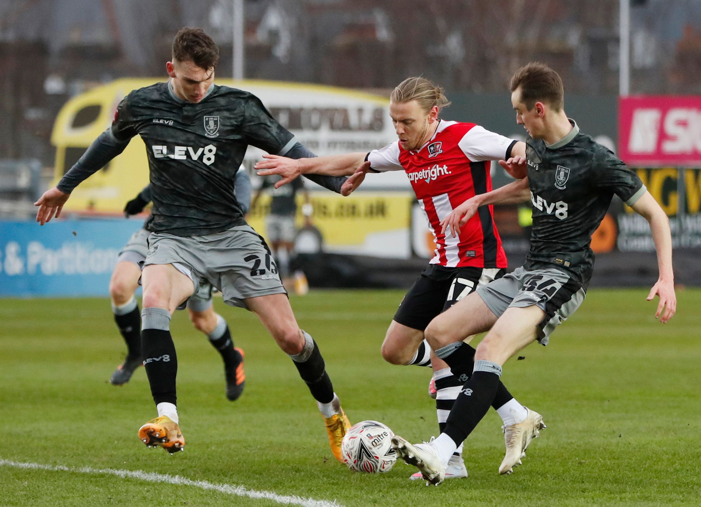 Soccer Football - FA Cup - Third Round - Exeter City v Sheffield Wednesday - St James Park, Exeter, Britain - January 9, 2021 Exeter City's Matt Jay in action with Sheffield Wednesday's Liam Shaw and Ciaran Brennan Action Images via Reuters/Paul Childs