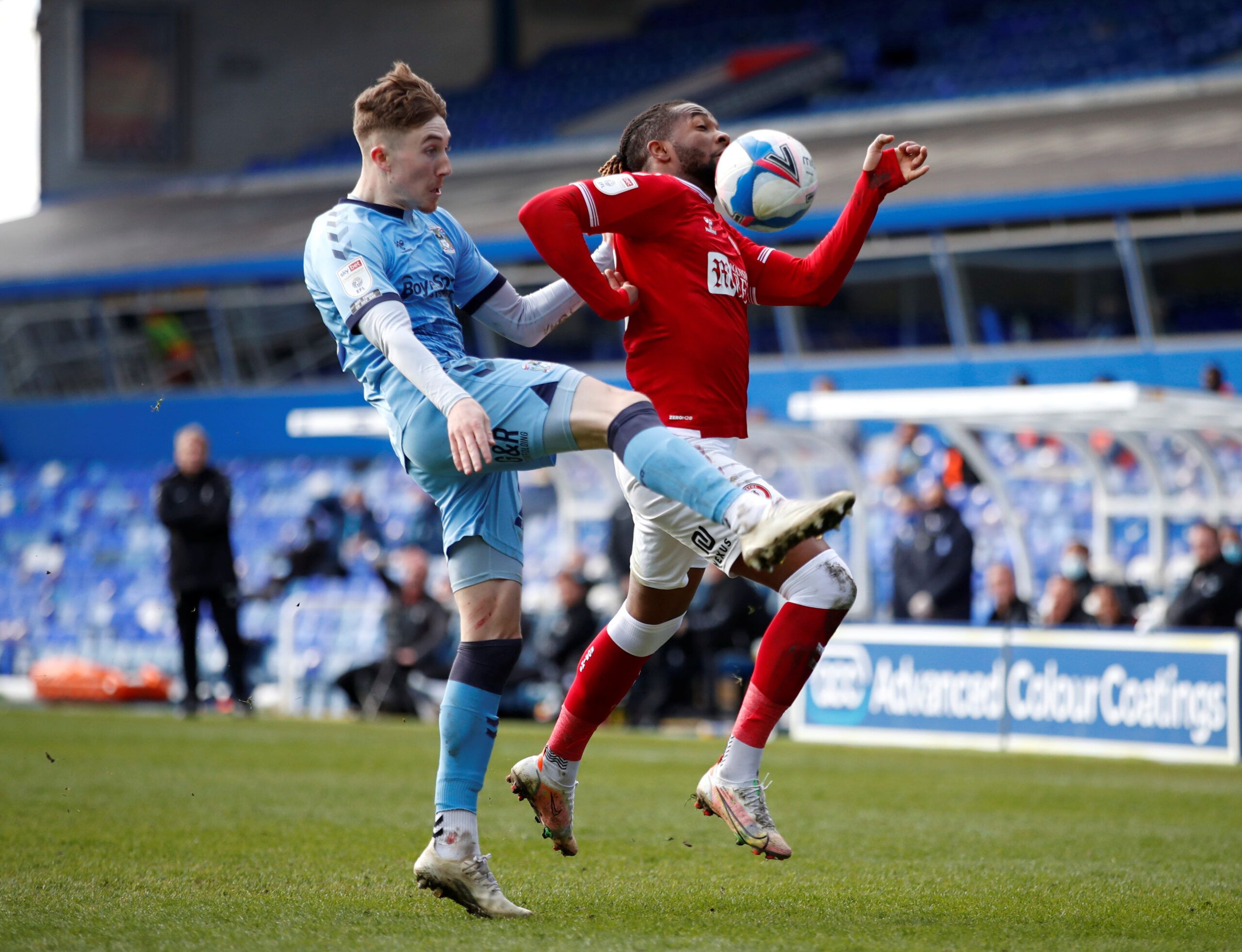 Soccer Football - Championship - Coventry City v Bristol City - St Andrew's, Birmingham, Britain - April 5, 2021  Coventry City's Josh Eccles in action with Bristol City's Kasey Palmer  Action Images/Andrew Boyers  EDITORIAL USE ONLY. No use with unauthorized audio, video, data, fixture lists, club/league logos or 
