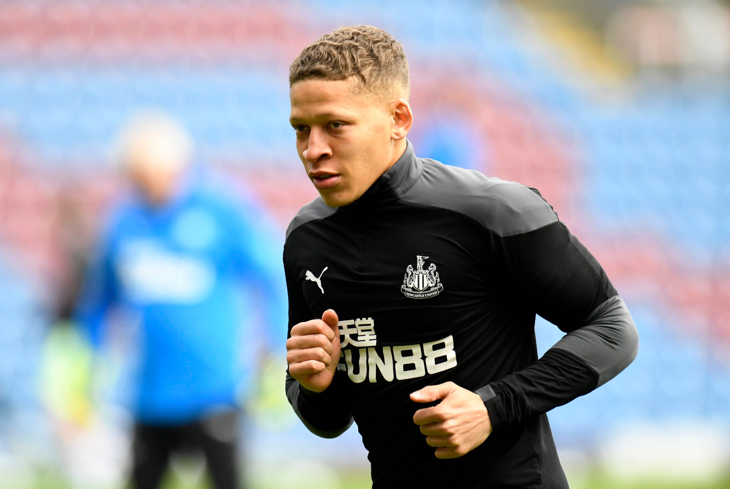 Soccer Football - Premier League - Burnley v Newcastle United - Turf Moor, Burnley, Britain - April 11, 2021 Newcastle United's Dwight Gayle during the warm up before the match Pool via REUTERS/Peter Powell EDITORIAL USE ONLY. No use with unauthorized audio, video, data, fixture lists, club/league logos or 'live' services. Online in-match use limited to 75 images, no video emulation. No use in betting, games or single club /league/player publications.  Please contact your account representative 