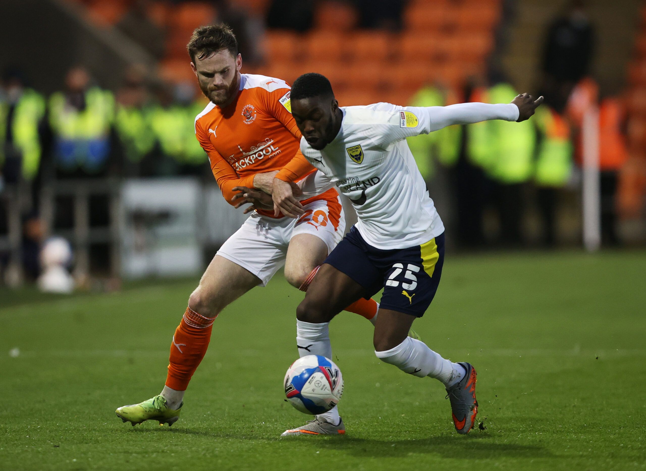 Soccer Football - League One Play-Off Semi Final Second Leg - Blackpool v Oxford United - Bloomfield Road Stadium, Blackpool, Britain - May 21, 2021 Blackpool's Oliver Turton in action with Oxford United's Olamide Shodipo Action Images/Molly Darlington EDITORIAL USE ONLY. No use with unauthorized audio, video, data, fixture lists, club/league logos or 'live' services. Online in-match use limited to 75 images, no video emulation. No use in betting, games or single club /league/player publications