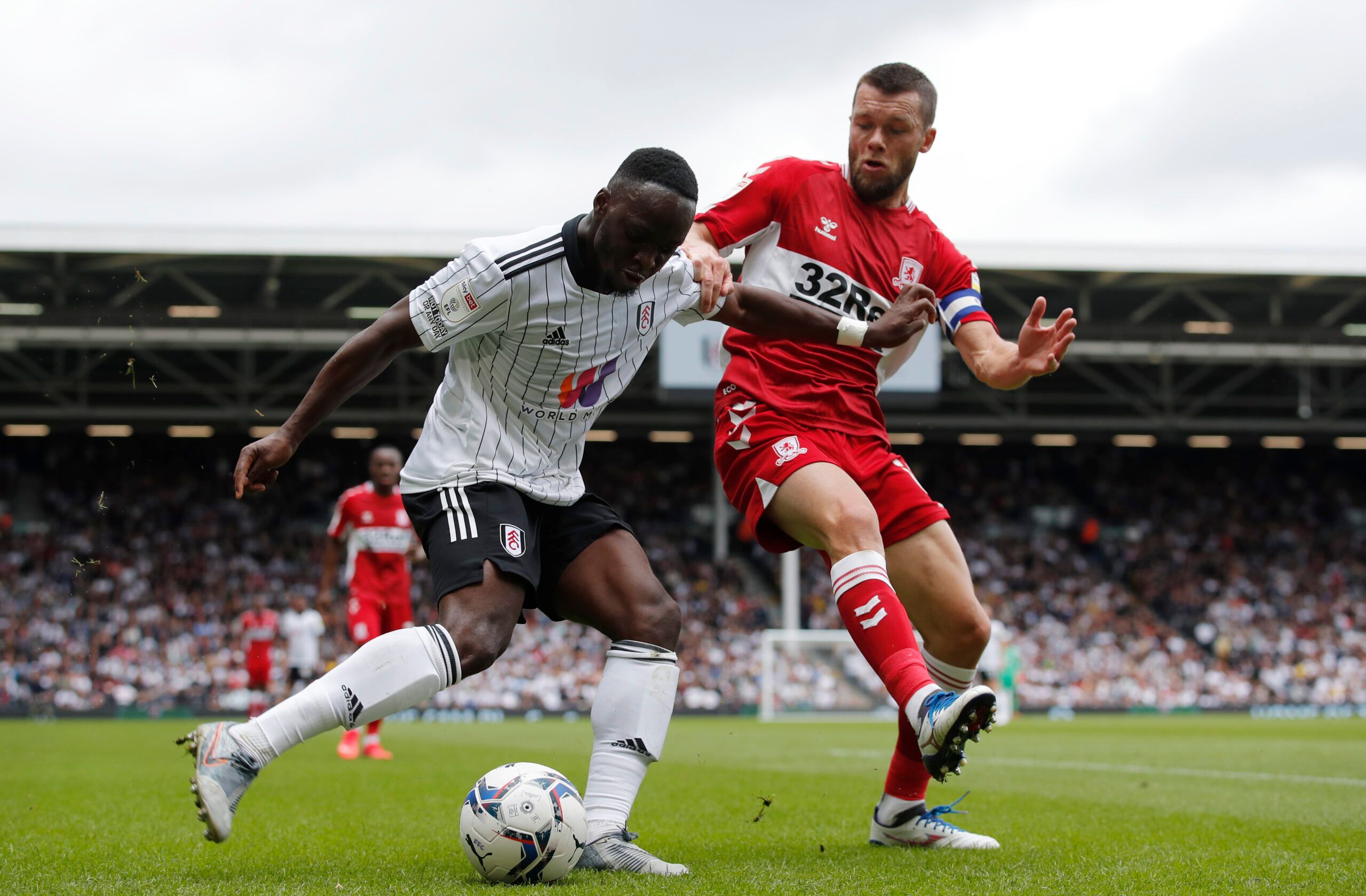 Soccer Football - Championship - Fulham v Middlesbrough - Craven Cottage, London, Britain - August 8, 2021 Fulham’s Neeskens Kebano in action with Middlesbrough's Jonny Howson Action Images/Andrew Couldridge