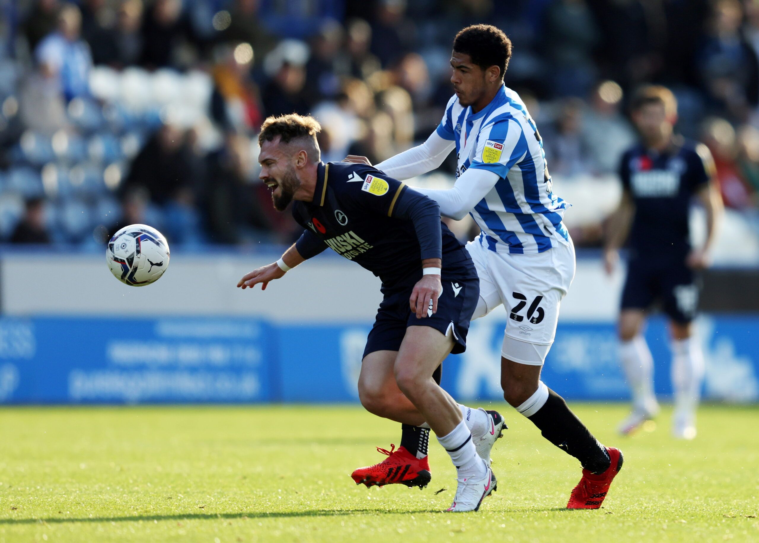 Soccer Football - Championship - Huddersfield Town v Millwall - John Smith's Stadium, Huddersfield, Britain - October 30, 2021 Huddersfield Town's Levi Colwill in action with Millwall's Tom Bradshaw  Action Images/John Clifton  EDITORIAL USE ONLY. No use with unauthorized audio, video, data, fixture lists, club/league logos or 