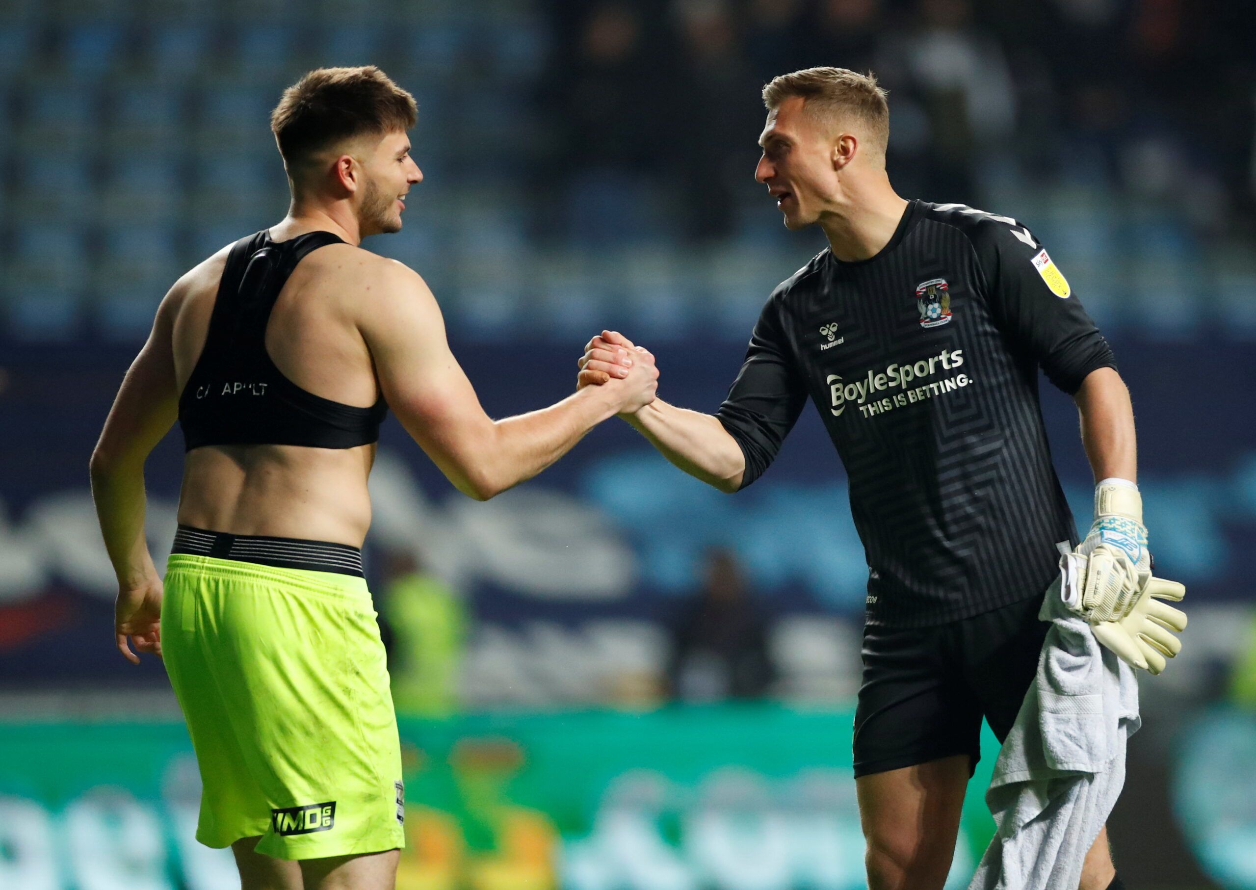 Soccer Football - Championship - Coventry City v Birmingham City - Building Society Arena, Coventry, Britain - November 23, 2021 Birmingham City's Matija Sarkic shakes hands with Coventry City's Simon Moore after the match  Action Images/Andrew Boyers