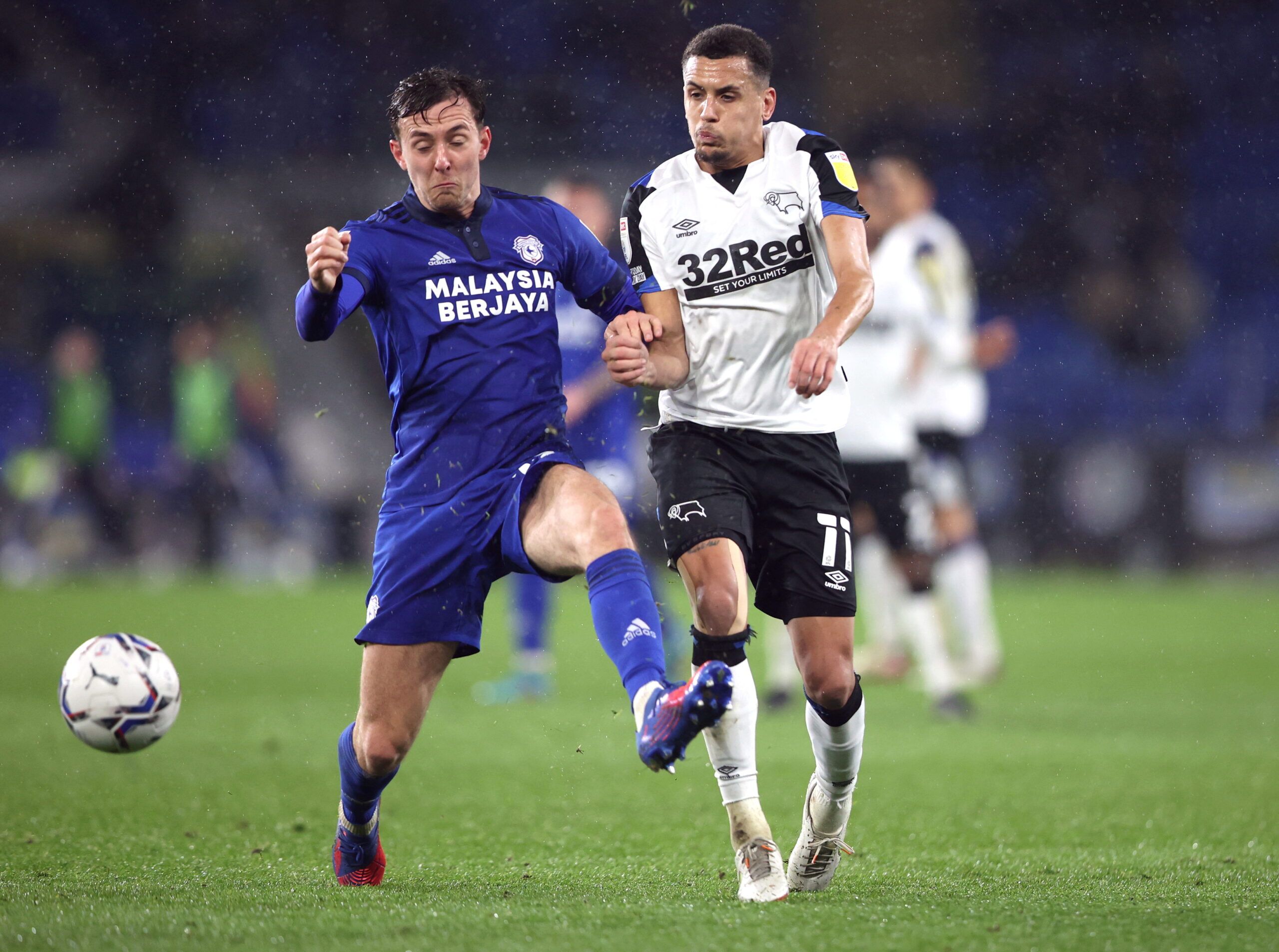 Soccer Football - Championship - Cardiff City v Derby County - Cardiff City Stadium, Cardiff, Britain - March 1, 2022   Cardiff City's Ryan Wintle in action with Derby County's Ravel Morrison    Action Images/Molly Darlington    EDITORIAL USE ONLY. No use with unauthorized audio, video, data, fixture lists, club/league logos or 