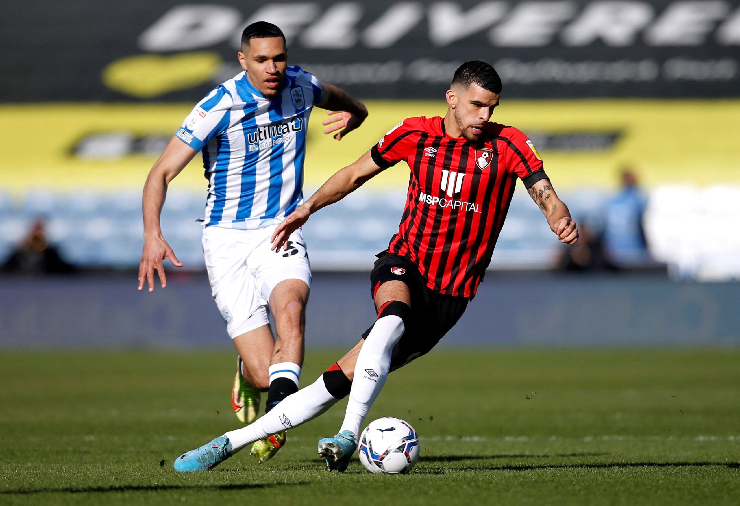 Soccer Football - Championship - Huddersfield Town v AFC Bournemouth - John Smith's Stadium, Huddersfield, Britain - March 19, 2022 AFC Bournemouth's Dominic Solanke in action with Huddersfield Town's Jon Russell  Action Images/Ed Sykes  EDITORIAL USE ONLY. No use with unauthorized audio, video, data, fixture lists, club/league logos or 
