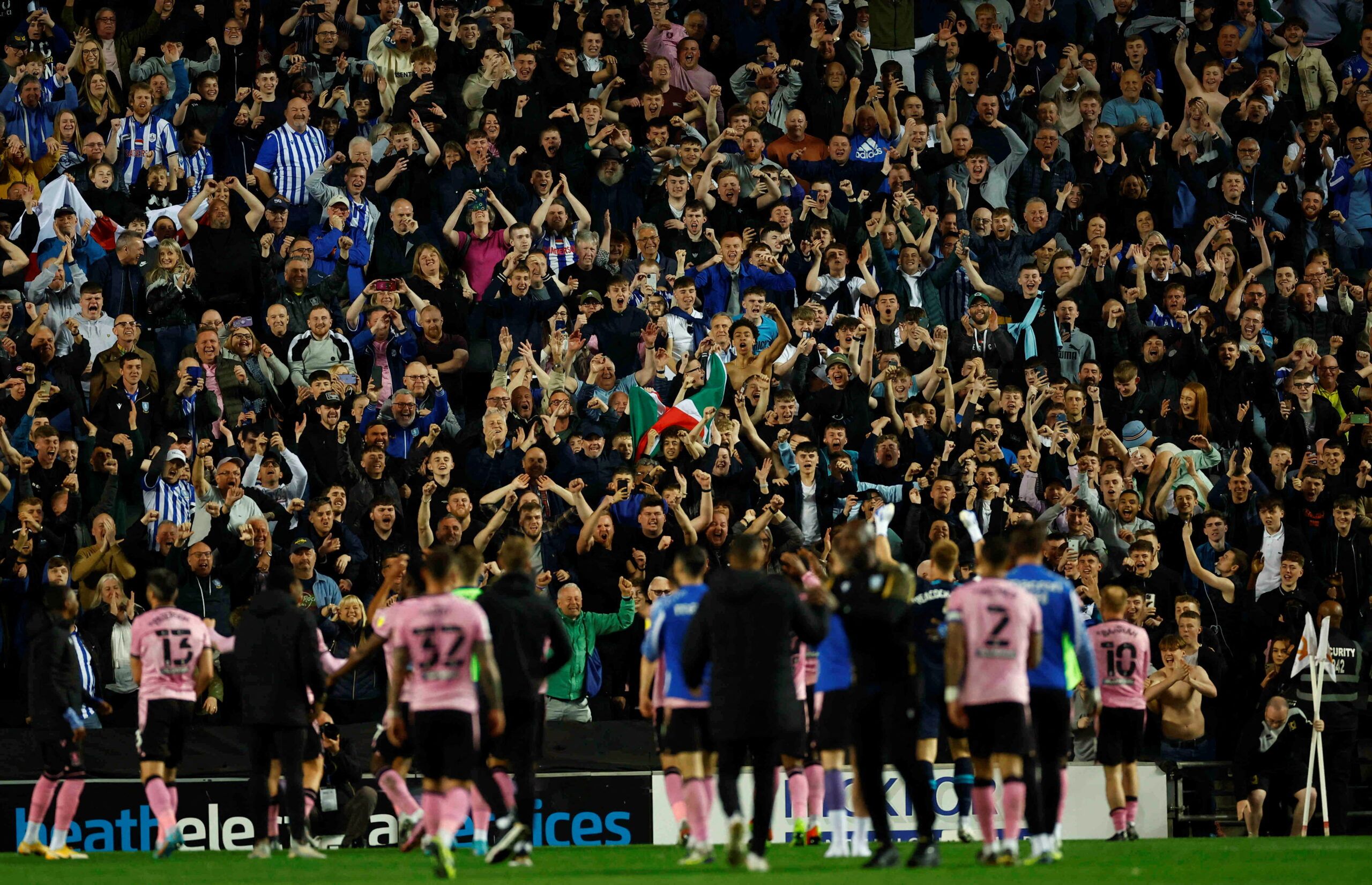 Soccer Football - League One - Milton Keynes Dons v Sheffield Wednesday - Stadium MK, Milton Keynes, Britain - April 16, 2022 Sheffield Wednesday players celebrate with fans after the match  Action Images/Andrew Boyers  EDITORIAL USE ONLY. No use with unauthorized audio, video, data, fixture lists, club/league logos or 