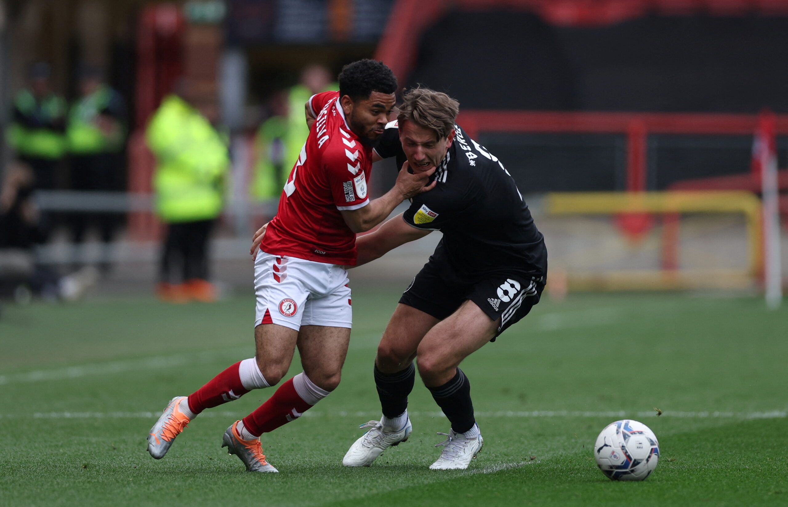 Soccer Football - Championship - Bristol City v Sheffield United - Ashton Gate Stadium, Bristol,  Britain - April 18, 2022  Bristol City's Jay Dasilva in action with Sheffield United's Sander Berge  Action Images/Matthew Childs  EDITORIAL USE ONLY. No use with unauthorized audio, video, data, fixture lists, club/league logos or 