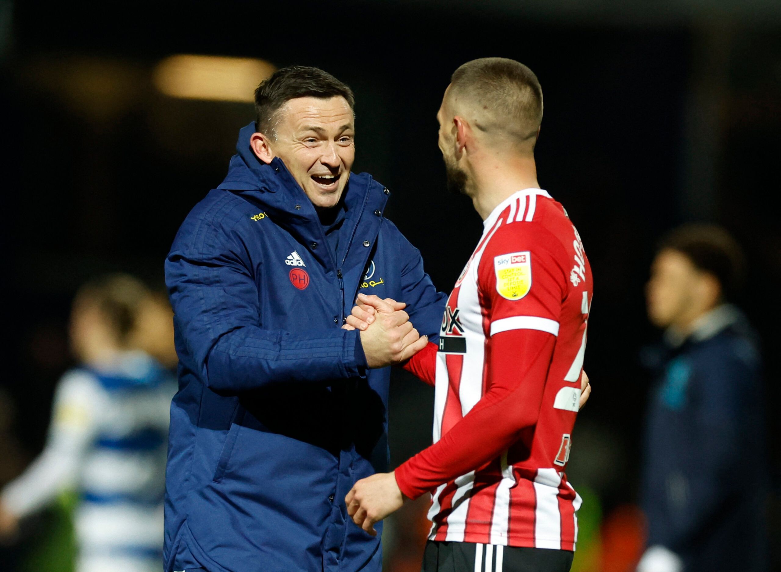 Soccer Football - Championship - Queens Park Rangers v Sheffield United - Loftus Road, London, Britain - April 29, 2022 Sheffield United's manger Paul Heckingbottom and Conor Hourihane celebrates after the match Action Images/Peter Cziborra EDITORIAL USE ONLY. No use with unauthorized audio, video, data, fixture lists, club/league logos or 'live' services. Online in-match use limited to 75 images, no video emulation. No use in betting, games or single club /league/player publications.  Please co