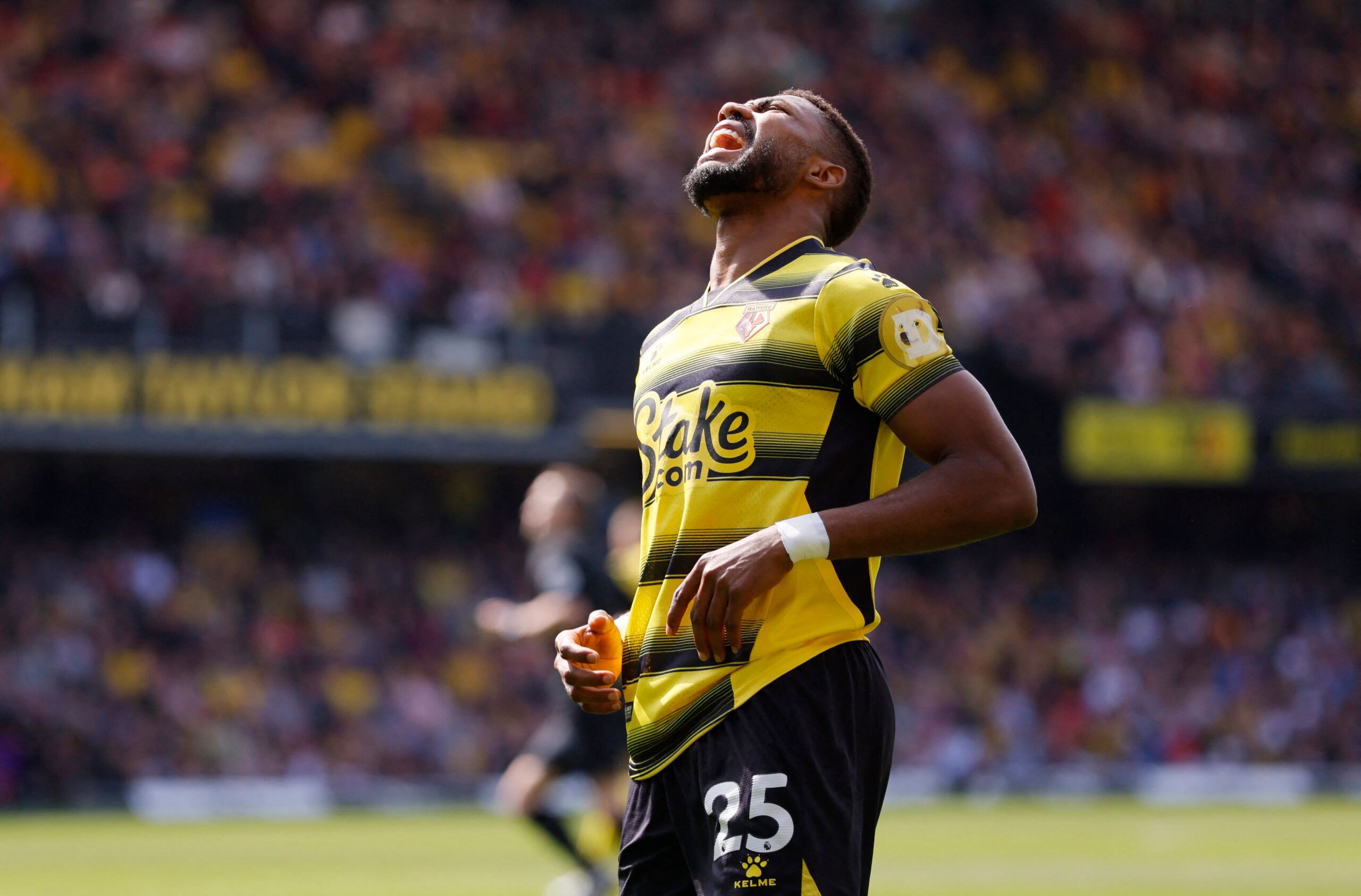Soccer Football - Premier League - Watford v Burnley - Vicarage Road, Watford, Britain - April 30, 2022 Watford's Emmanuel Dennis reacts after a missed chance Action Images via Reuters/Andrew Couldridge EDITORIAL USE ONLY. No use with unauthorized audio, video, data, fixture lists, club/league logos or 'live' services. Online in-match use limited to 75 images, no video emulation. No use in betting, games or single club /league/player publications.  Please contact your account representative for 
