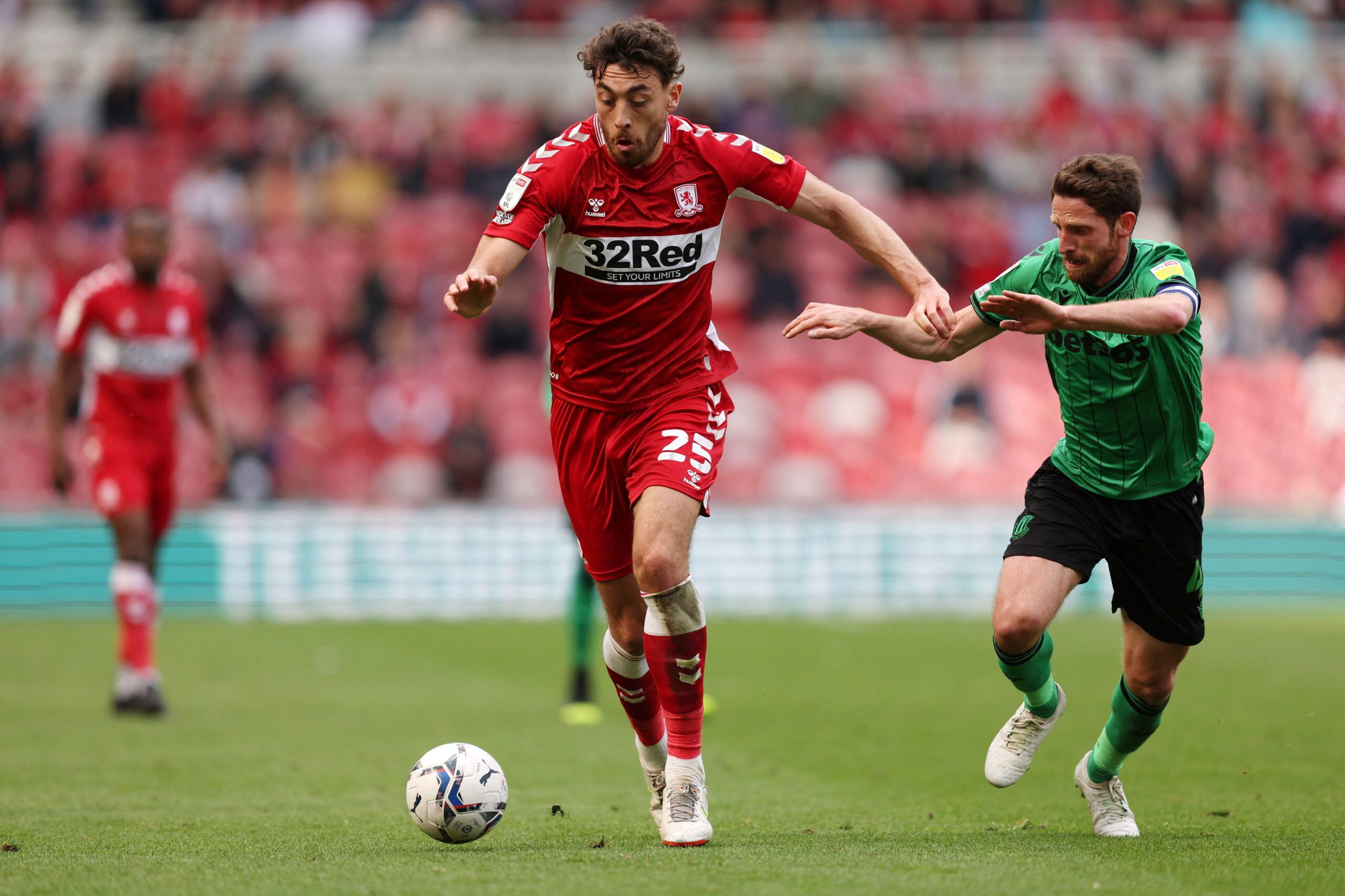 Soccer Football - Championship - Middlesbrough v Stoke City - Riverside Stadium, Middlesbrough, Britain - April 30, 2022 Middlesbrough's Matt Crooks in action with Stoke City's Joe Allen   Action Images/John Clifton  EDITORIAL USE ONLY. No use with unauthorized audio, video, data, fixture lists, club/league logos or 