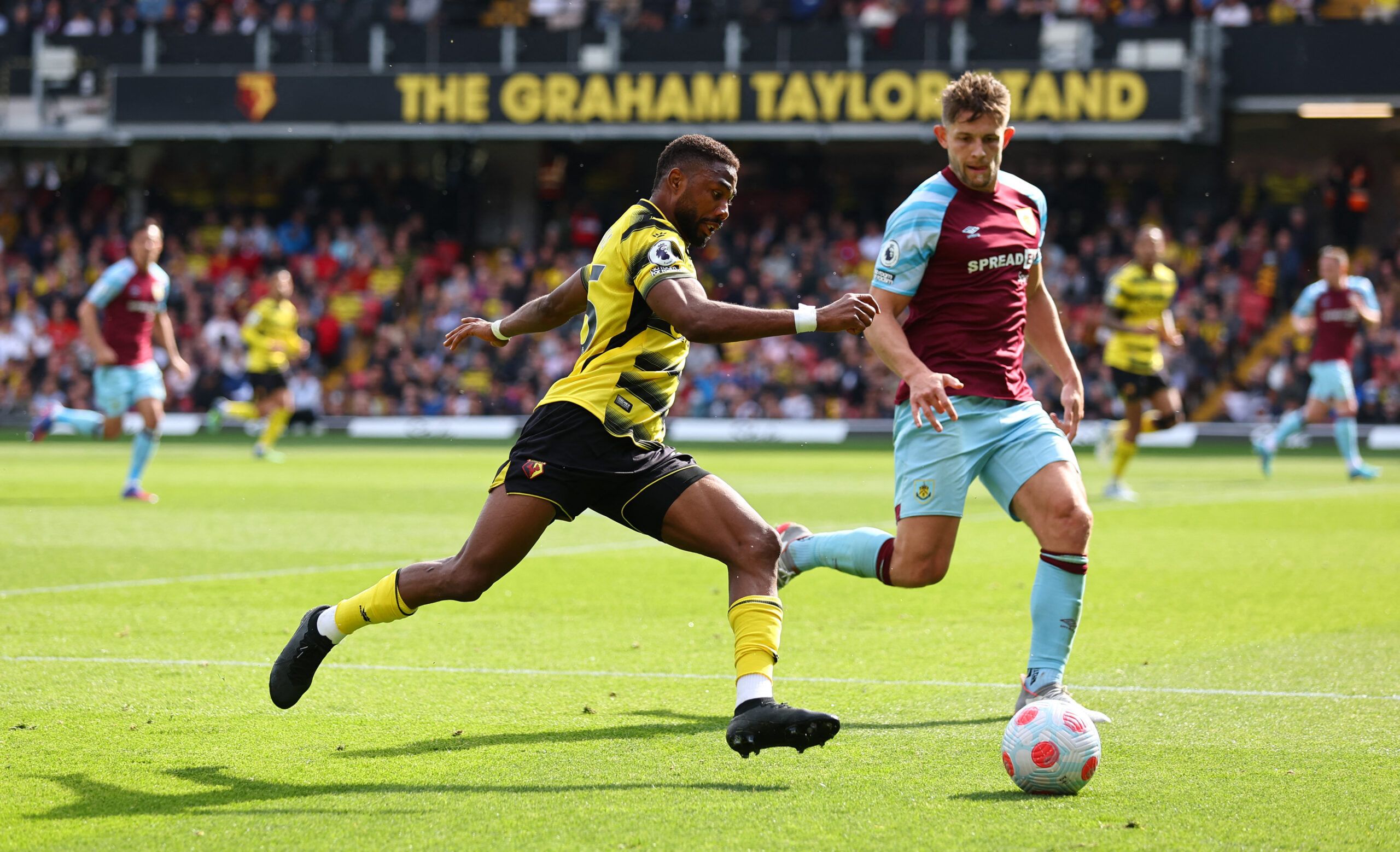 Soccer Football - Premier League - Watford v Burnley - Vicarage Road, Watford, Britain - April 30, 2022 Watford's Emmanuel Dennis in action with Burnley's James Tarkowski REUTERS/David Klein EDITORIAL USE ONLY. No use with unauthorized audio, video, data, fixture lists, club/league logos or 'live' services. Online in-match use limited to 75 images, no video emulation. No use in betting, games or single club /league/player publications.  Please contact your account representative for further deta