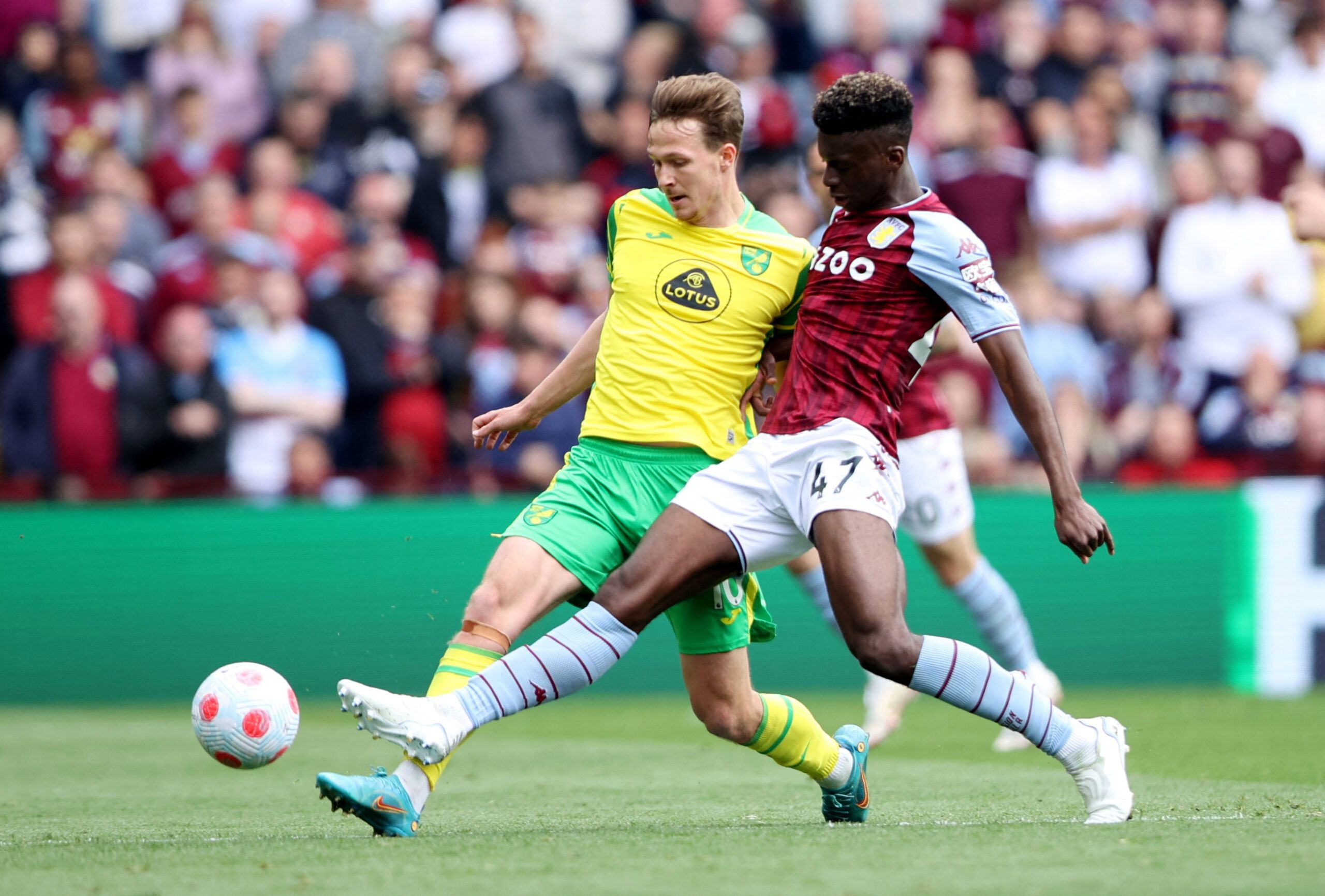Soccer Football - Premier League - Aston Villa v Norwich City - Villa Park, Birmingham, Britain - April 30, 2022 Aston Villa's Tim Iroegbunam in action with Norwich City's Kieran Dowell Action Images via Reuters/Molly Darlington EDITORIAL USE ONLY. No use with unauthorized audio, video, data, fixture lists, club/league logos or 'live' services. Online in-match use limited to 75 images, no video emulation. No use in betting, games or single club /league/player publications.  Please contact your a