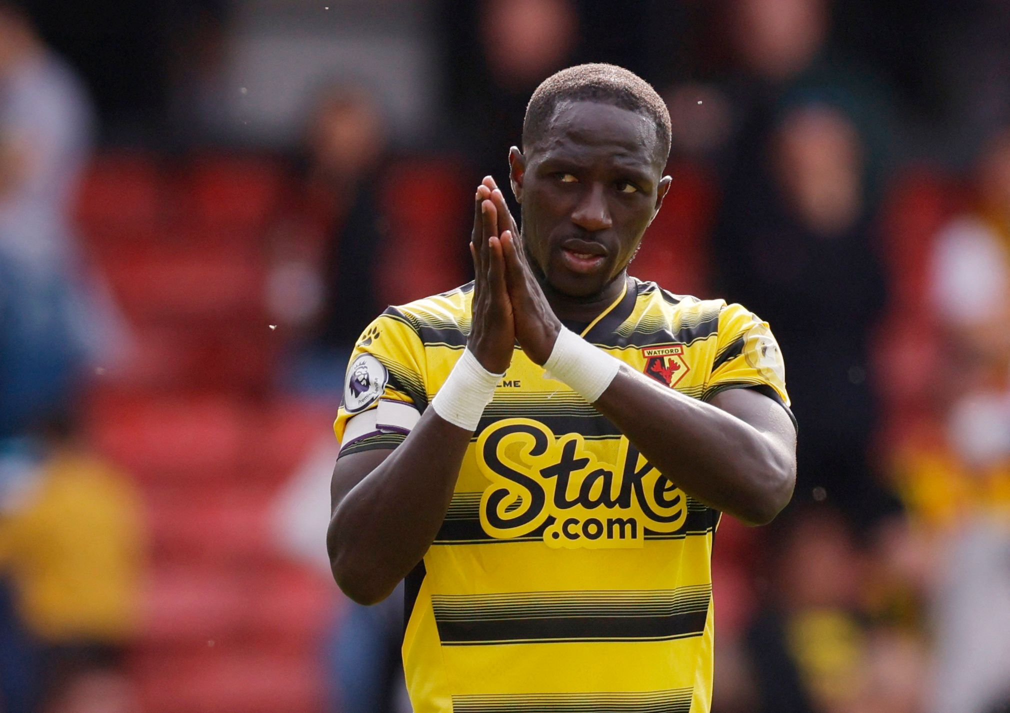 Soccer Football - Premier League - Watford v Burnley - Vicarage Road, Watford, Britain - April 30, 2022 Watford's Moussa Sissoko applauds the fans after the match Action Images via Reuters/Andrew Couldridge EDITORIAL USE ONLY. No use with unauthorized audio, video, data, fixture lists, club/league logos or 'live' services. Online in-match use limited to 75 images, no video emulation. No use in betting, games or single club /league/player publications.  Please contact your account representative 