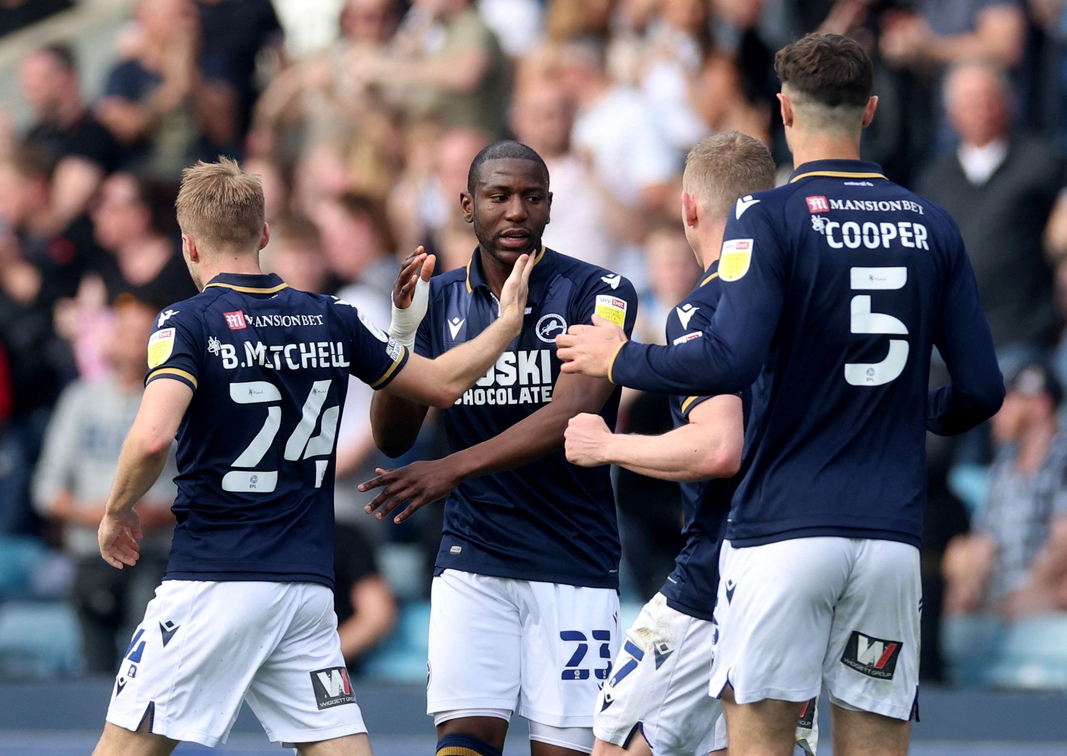 Soccer Football - Championship - Millwall v Peterborough United - The Den, London, Britain - April 30, 2022 Millwall's Benik Afobe celebrates scoring their first goal with teammates   Action Images/Paul Childs  EDITORIAL USE ONLY. No use with unauthorized audio, video, data, fixture lists, club/league logos or 