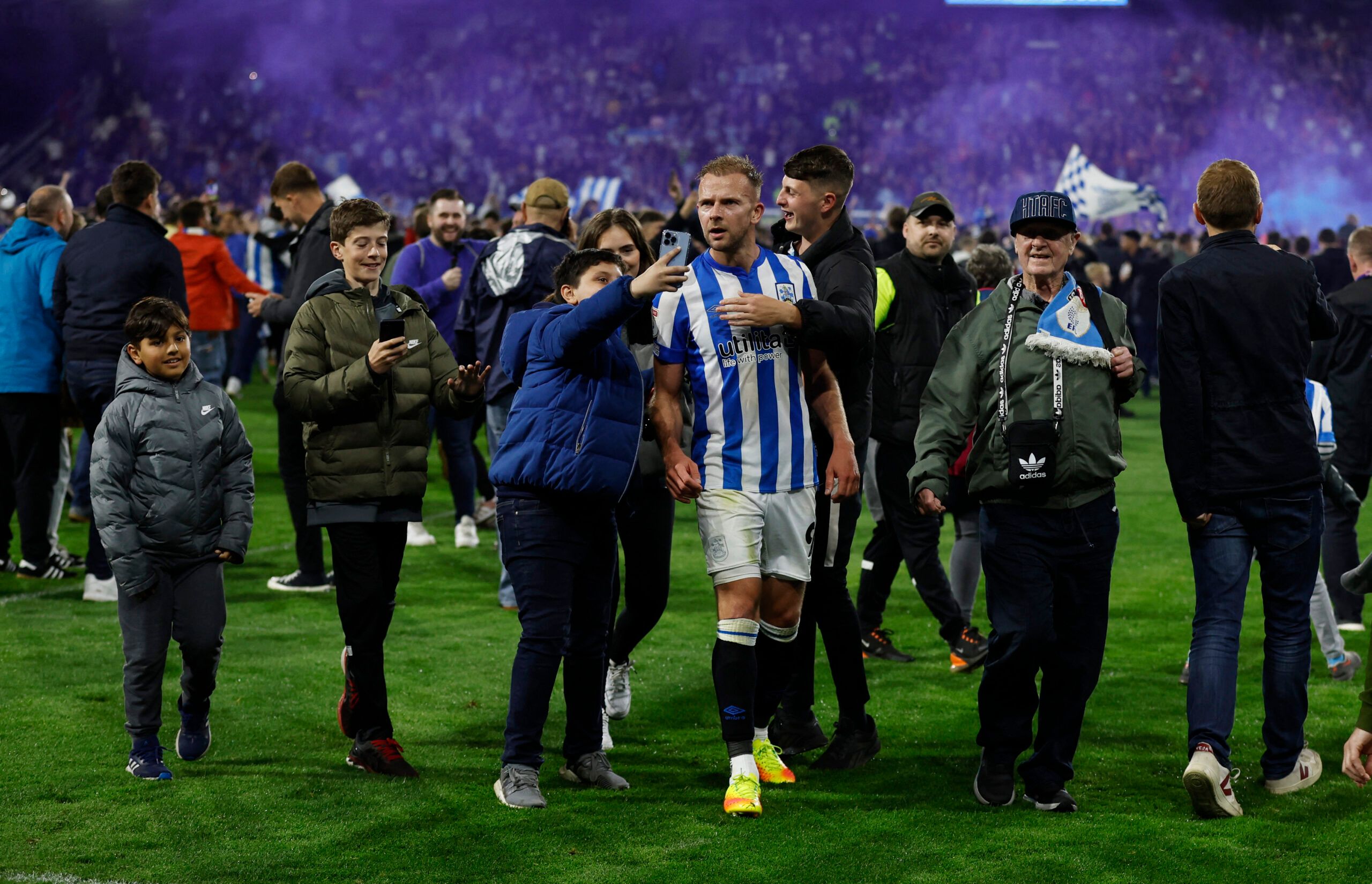 Soccer Football - Championship - Play-Offs Second Leg - Huddersfield Town v Luton Town - John Smith's Stadium, Huddersfield, Britain - May 16, 2022 Huddersfield Town's Jordan Rhodes celebrates with fans after reaching the Championship Play-Off Final Action Images via Reuters/Jason Cairnduff