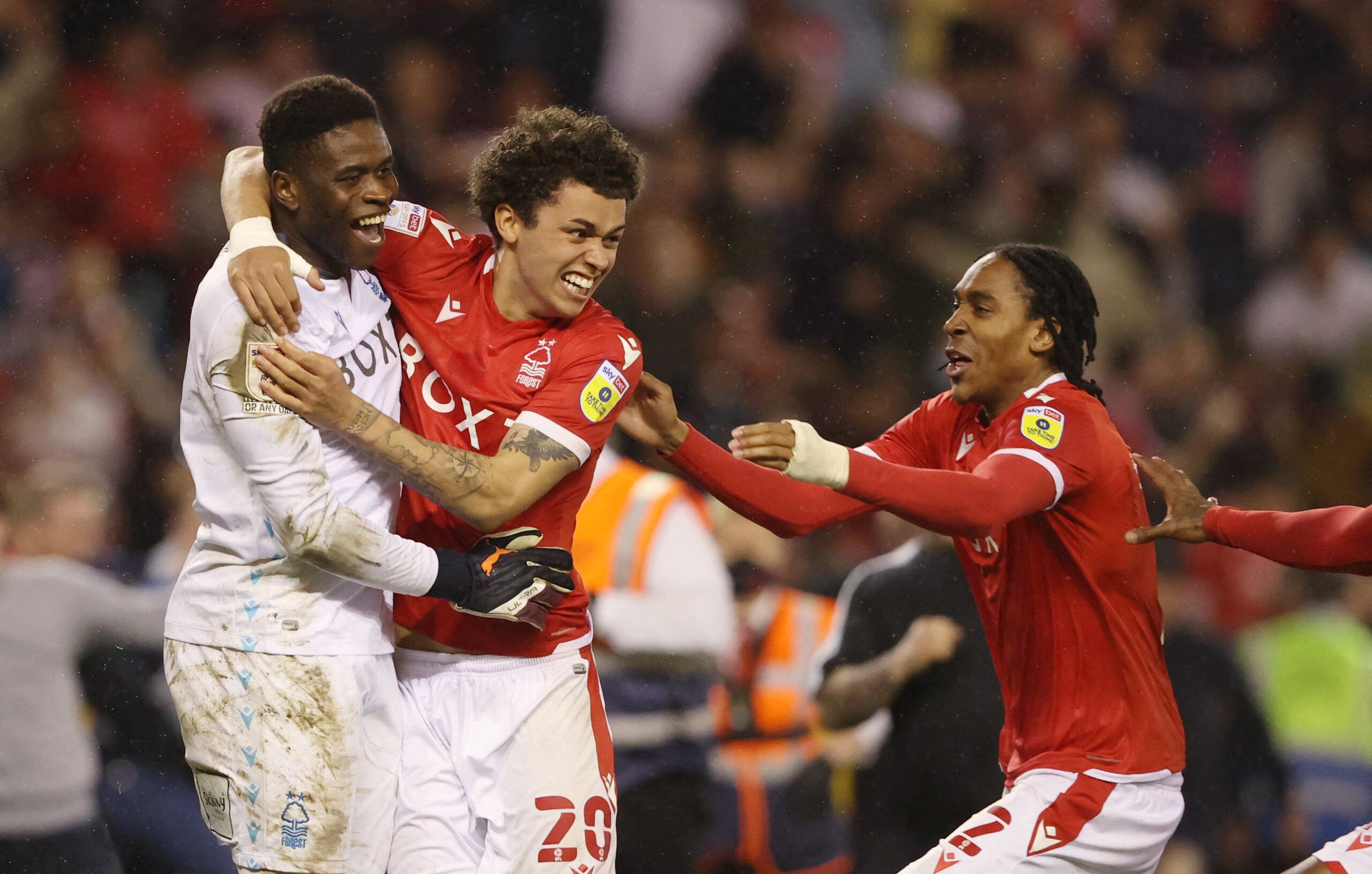 Soccer Football - Championship - Play-Offs Second Leg - Nottingham Forest v Sheffield United - The City Ground, Nottingham, Britain - May 17, 2022 Nottingham Forest's Brice Samba, Brennan Johnson and Djed Spence celebrate after reaching the Championship Play Off Final Action Images via Reuters/Molly Darlington
