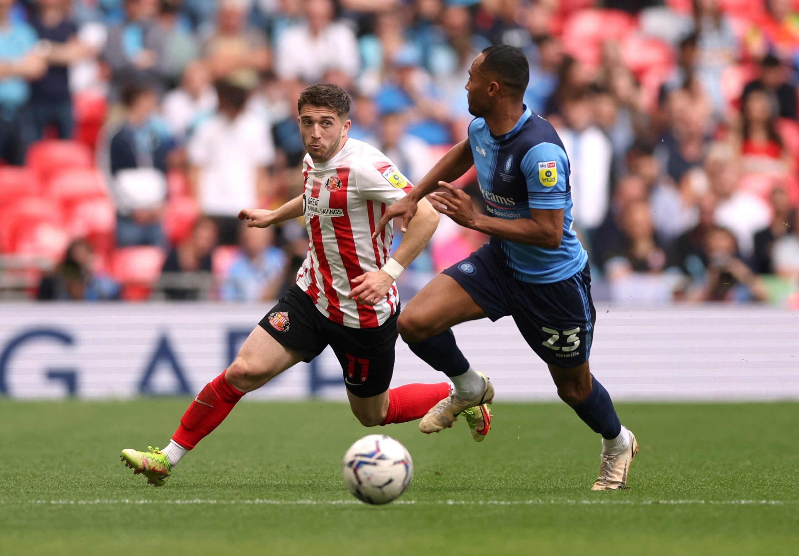 Soccer Football - League One Play-Off Final - Sunderland v Wycombe Wanderers - Wembley Stadium, London, Britain - May 21, 2022  Sunderland's Lynden Gooch in action with Wycombe Wanderers' Jordan Obita Action Images/Matthew Childs EDITORIAL USE ONLY. No use with unauthorized audio, video, data, fixture lists, club/league logos or 'live' services. Online in-match use limited to 75 images, no video emulation. No use in betting, games or single club /league/player publications.  Please contact your 